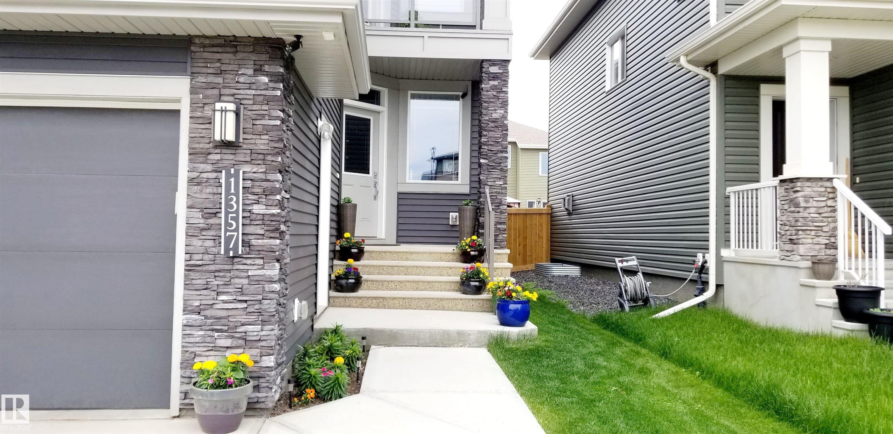 Doorway to property with stone siding - 1357 Watt Drive, Edmonton, AB - Outdoor