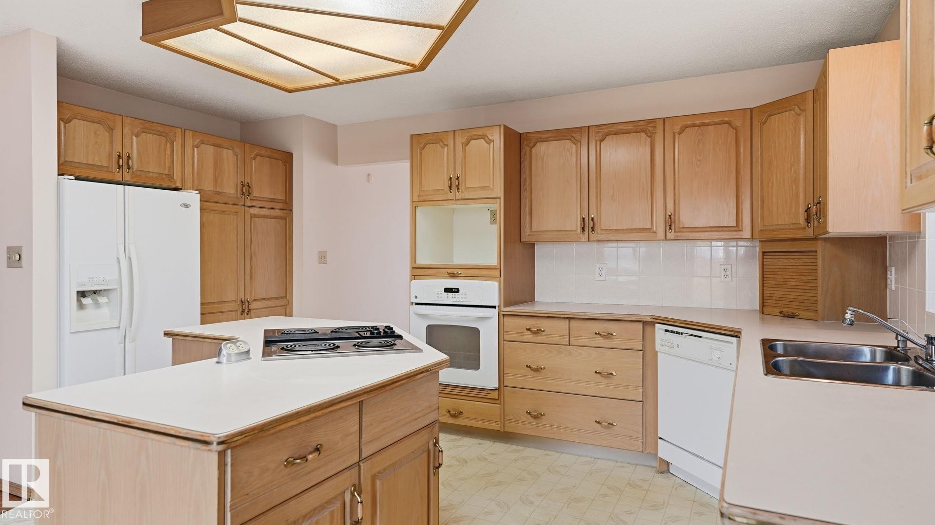 Edmonton, AB - Indoor Photo Showing Kitchen With Double Sink