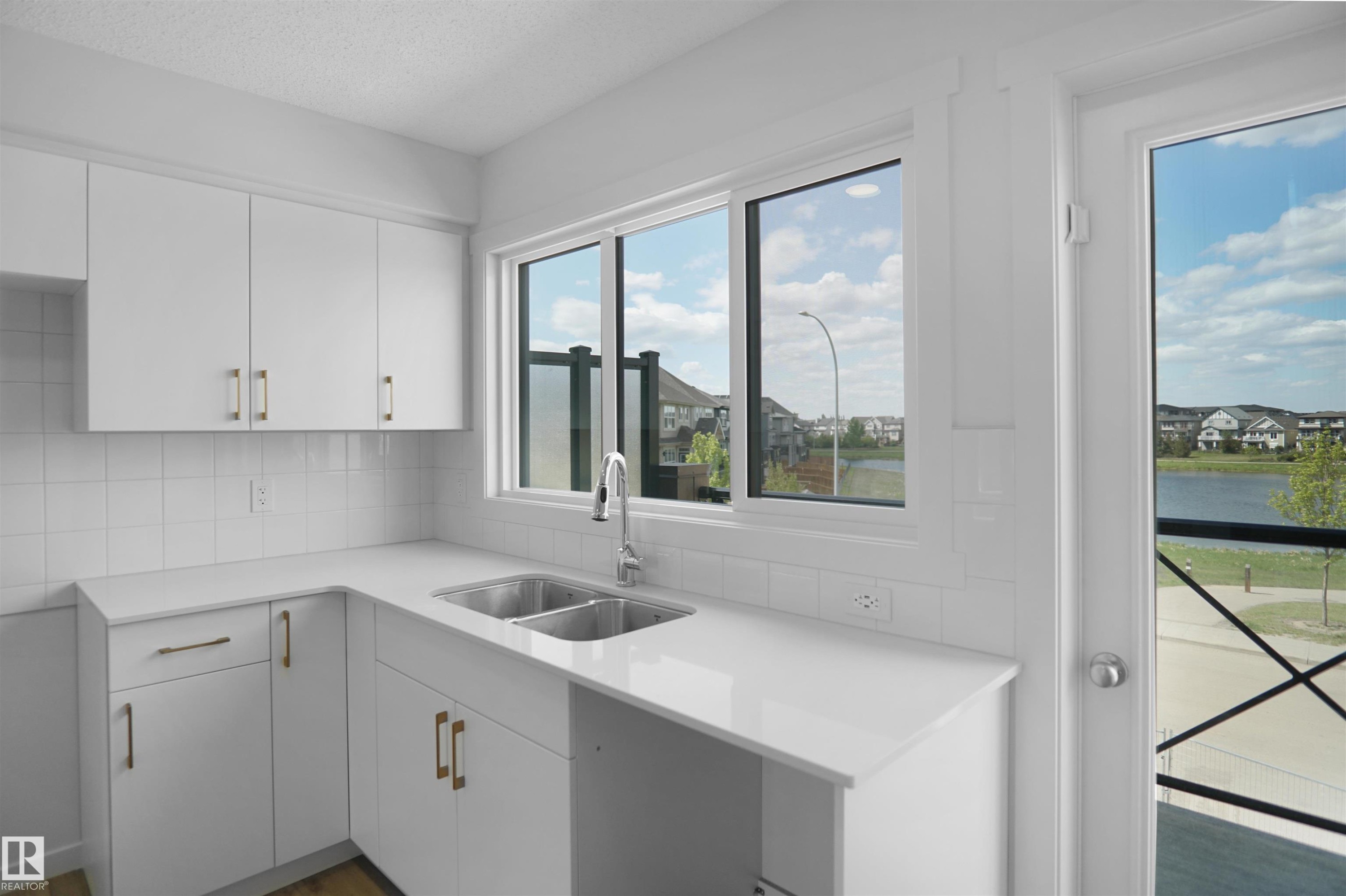 100 3705 141 Street, Edmonton, AB - Indoor Photo Showing Kitchen With Double Sink