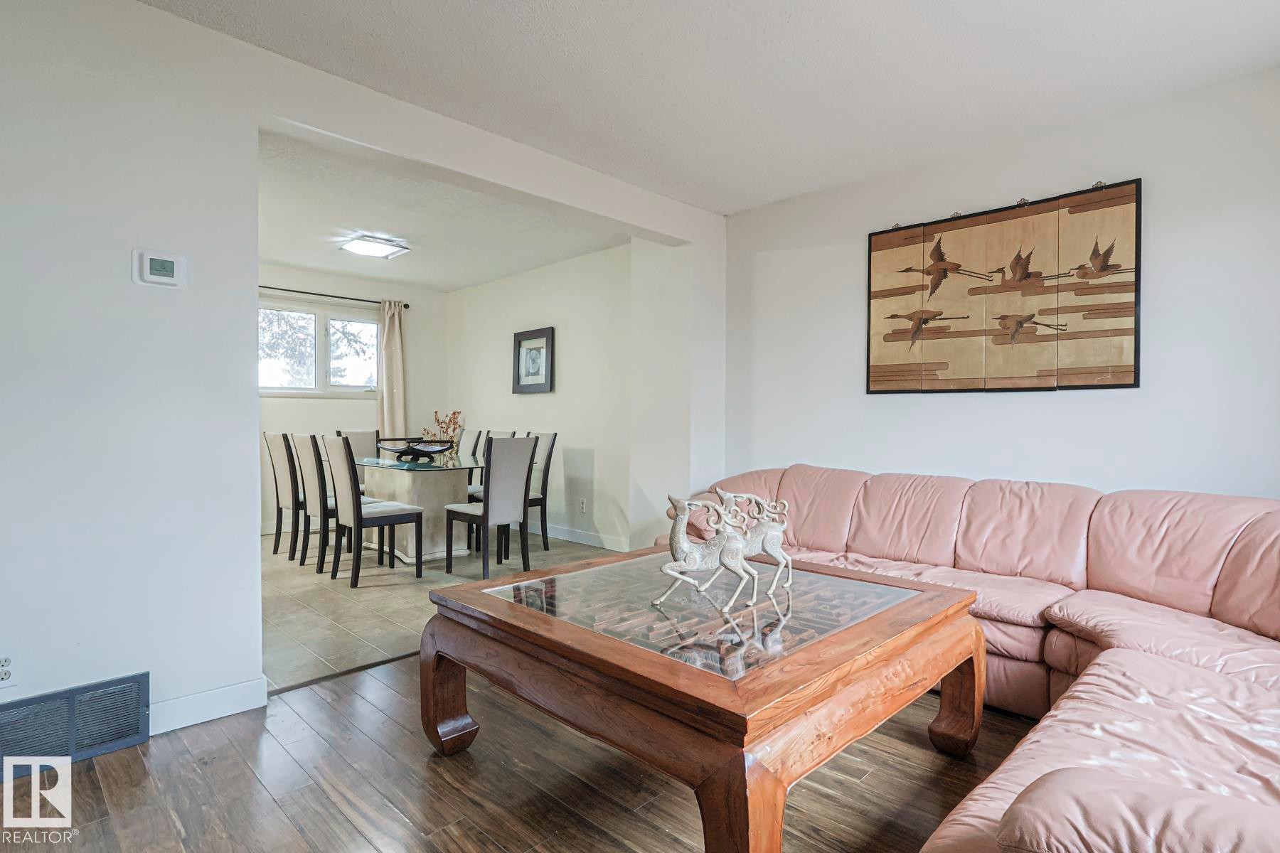 Living room featuring wood finished floors and baseboards - 51 Belmead Gardens, Edmonton, AB - Indoor Photo Showing Living Room