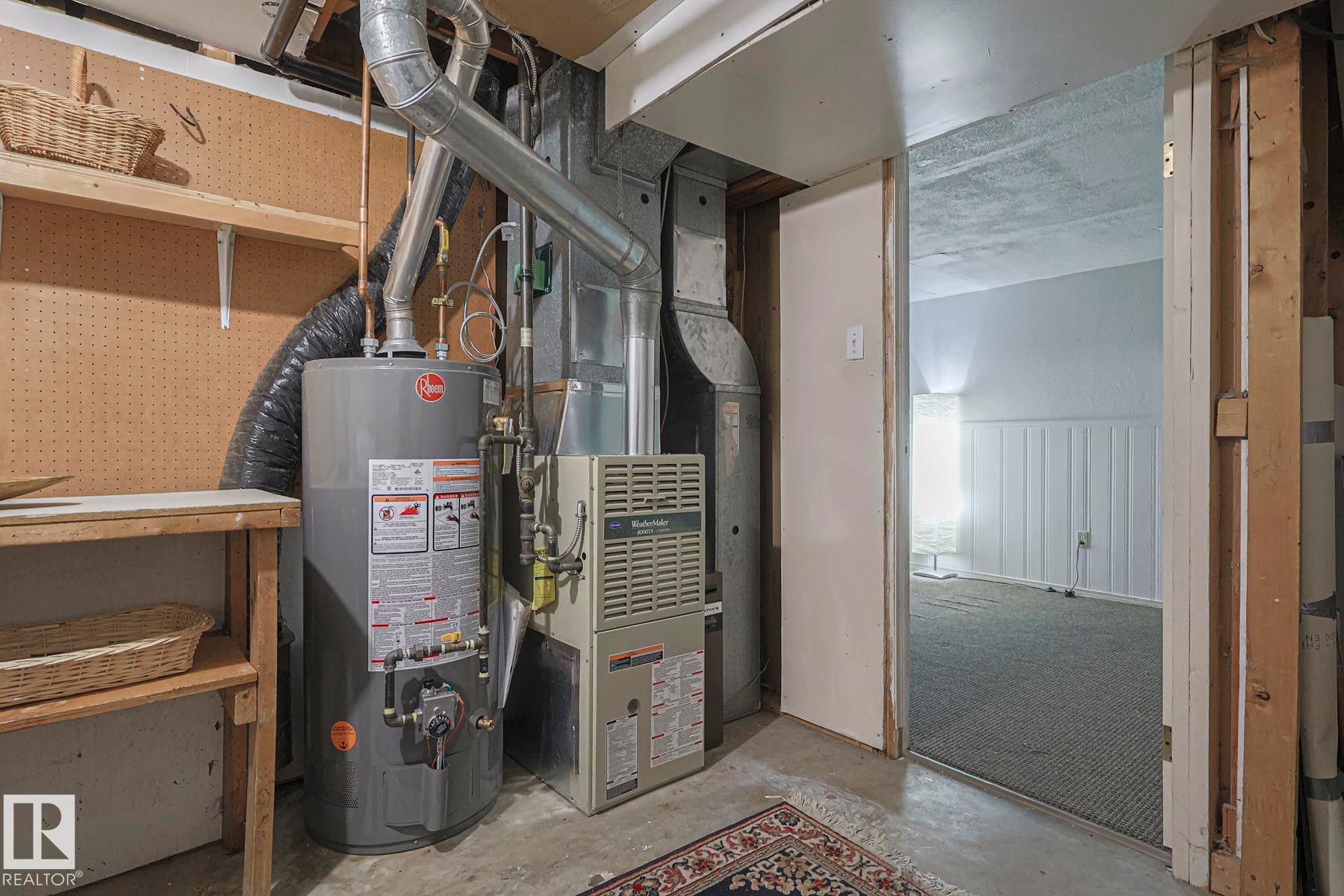 Utility room featuring gas water heater and heating unit - 51 Belmead Gardens, Edmonton, AB - Indoor Photo Showing Basement