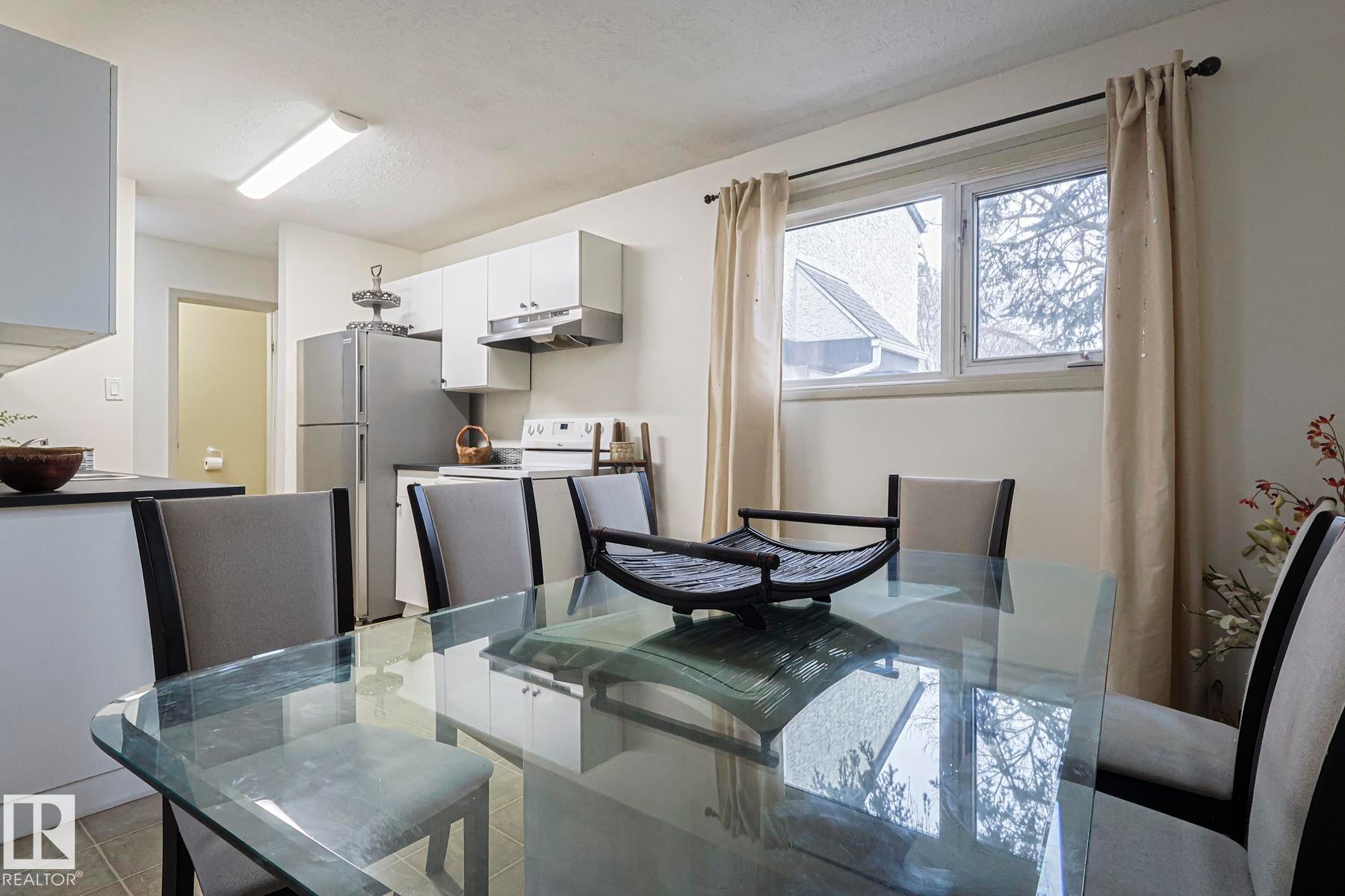 Dining area with light tile patterned floors - 51 Belmead Gardens, Edmonton, AB - Indoor