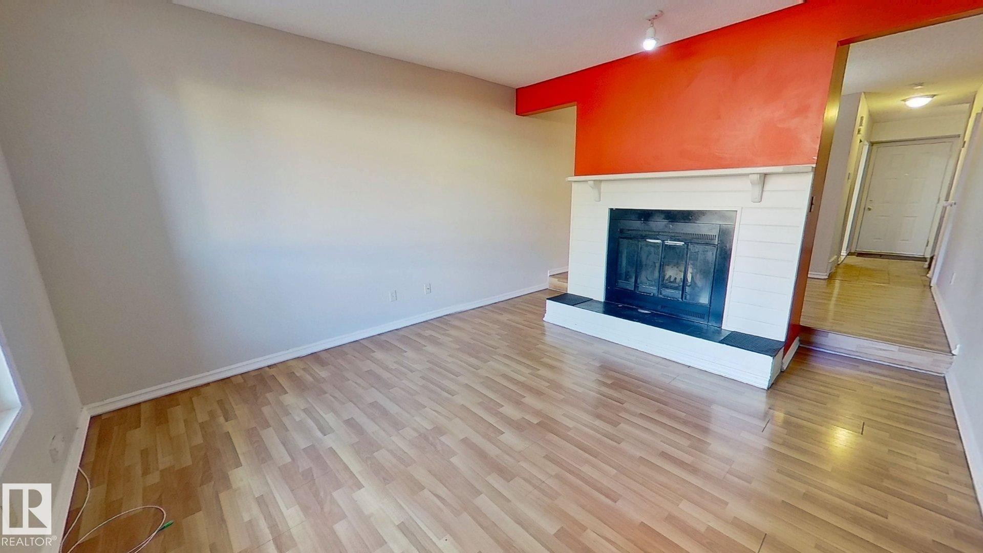 59 7604 29 Avenue, Edmonton, AB - Indoor Photo Showing Living Room With Fireplace