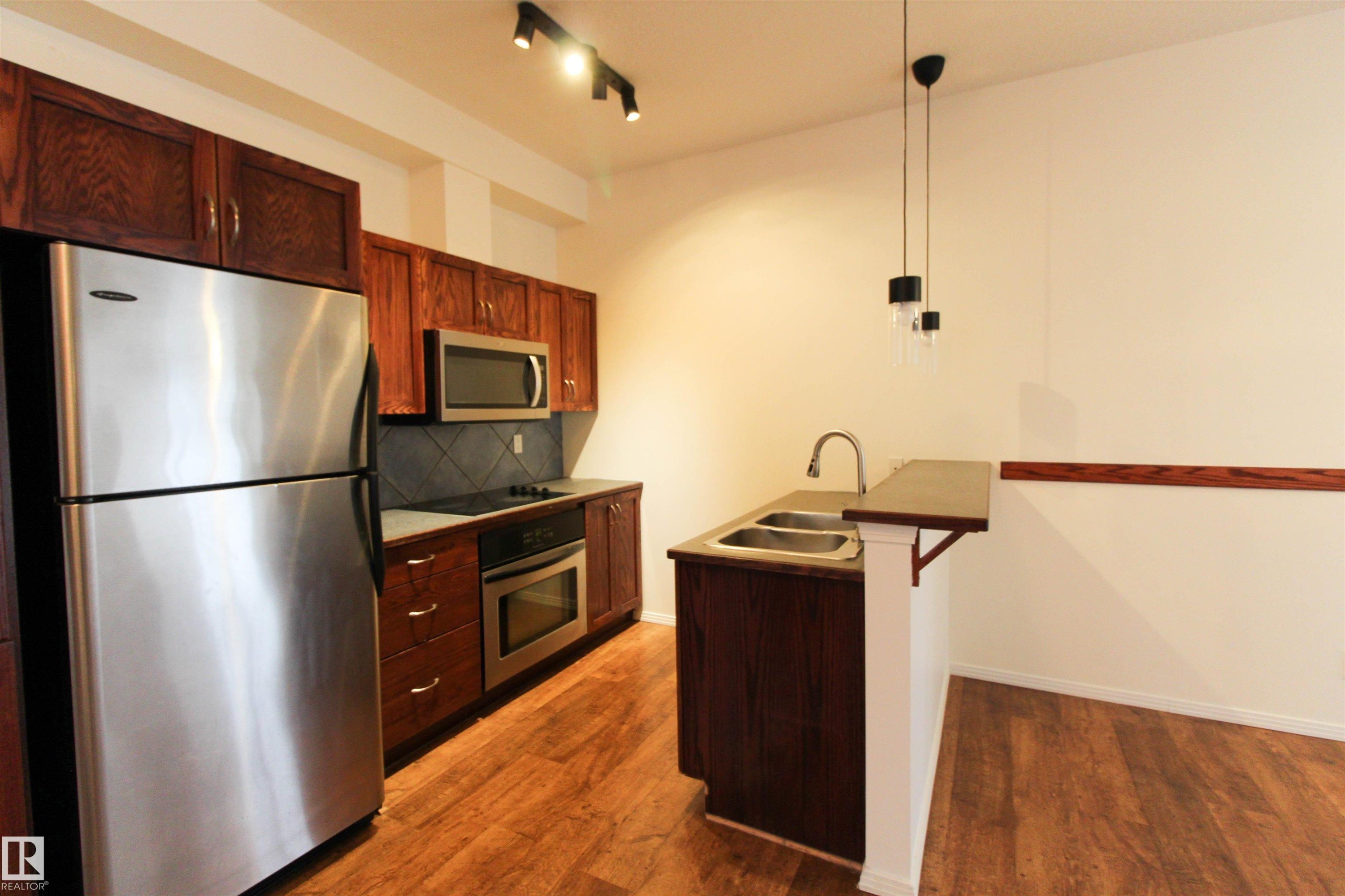 347 4827 104A Street, Edmonton, AB - Indoor Photo Showing Kitchen With Double Sink