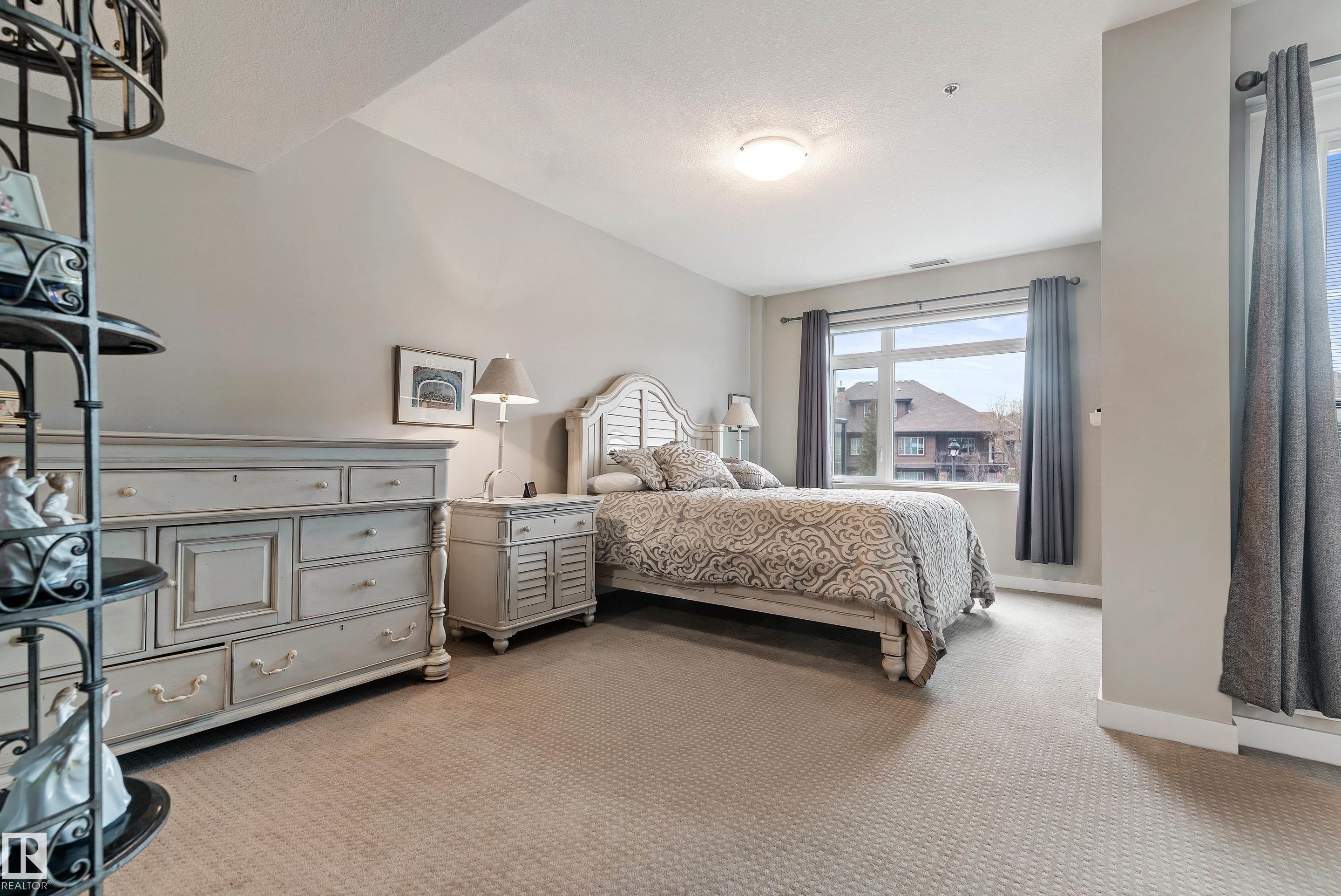 101 5151 Windermere Boulevard, Edmonton, AB - Indoor Photo Showing Bedroom