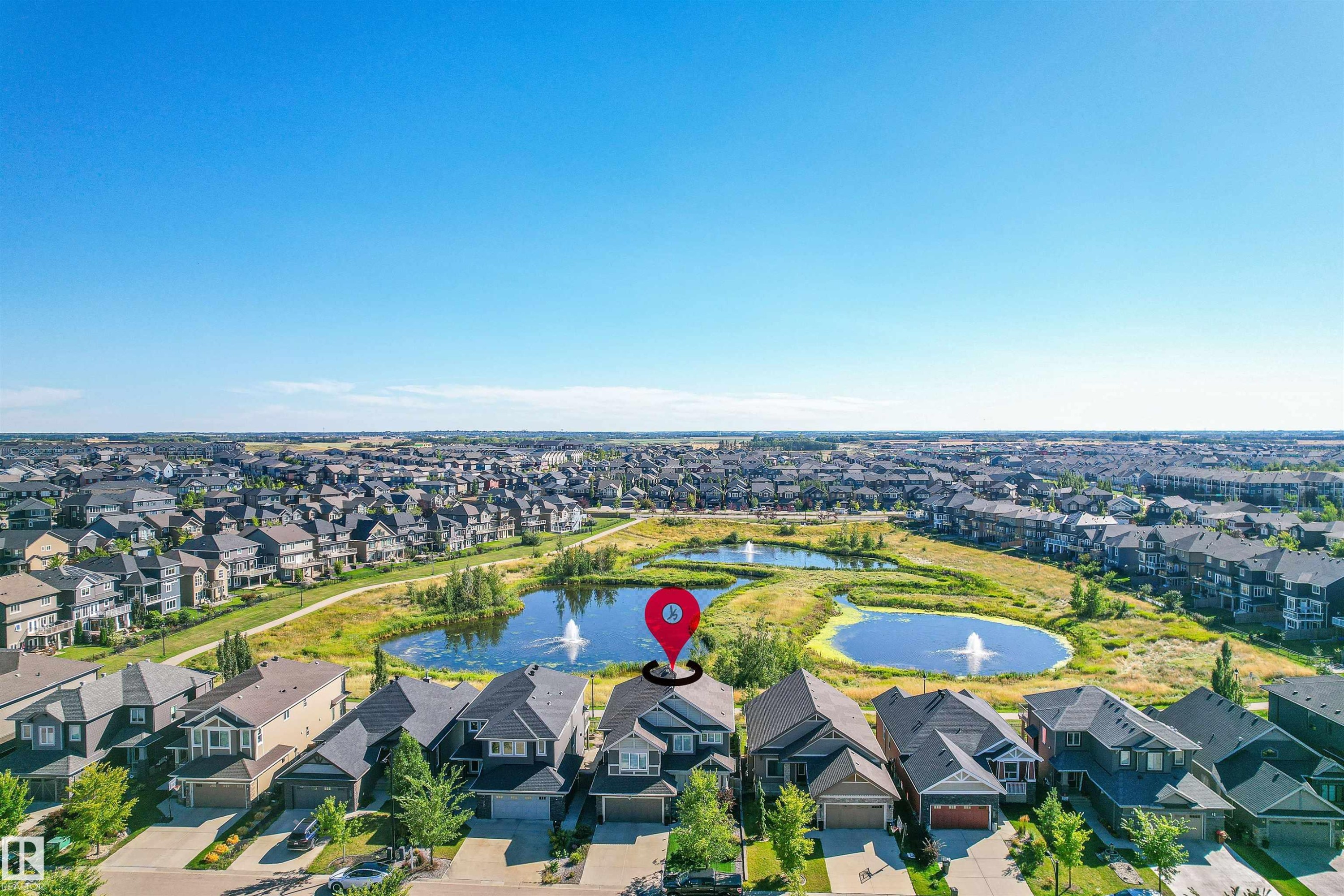 View of property location featuring a large body of water and nearby suburban area - 3198 Winspear Crescent Sw, Edmonton, AB - Outdoor With View