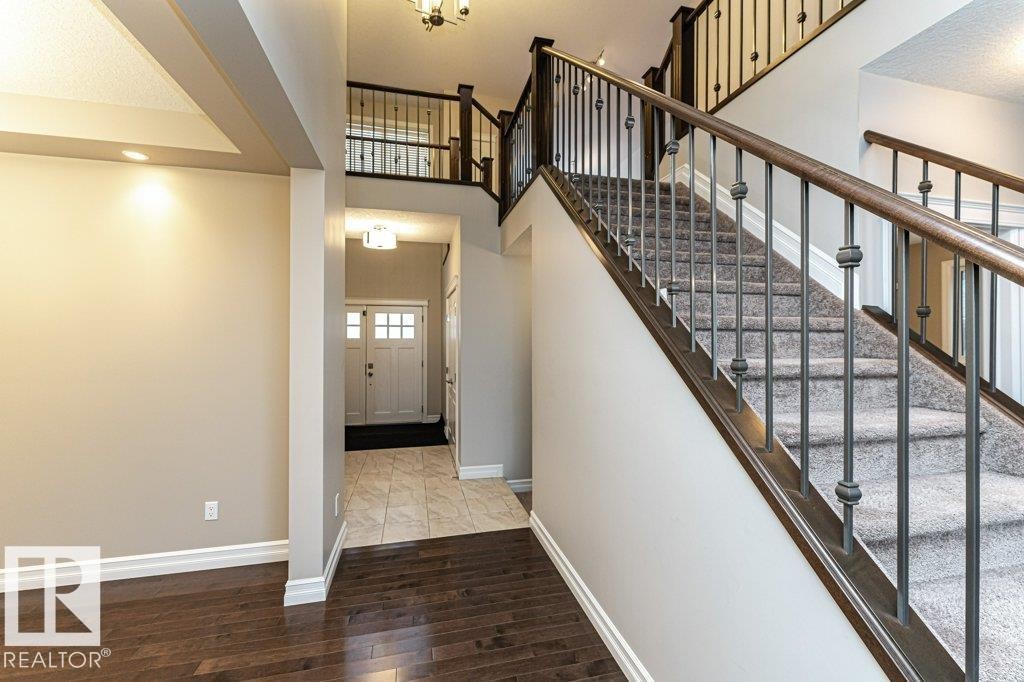Foyer featuring a towering ceiling and wood finished floors - 3198 Winspear Crescent Sw, Edmonton, AB - Indoor Photo Showing Other Room