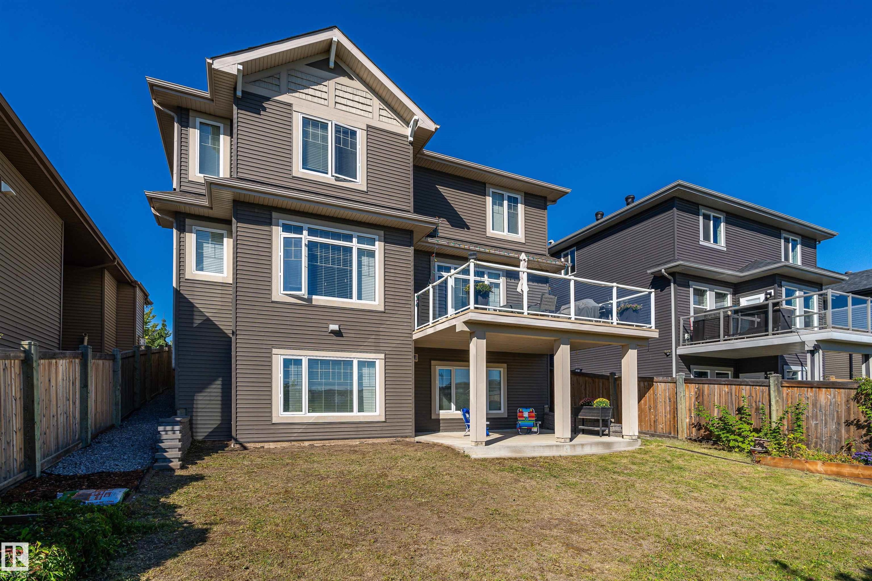 Rear view of property featuring a patio area and a fenced backyard - 3198 Winspear Crescent Sw, Edmonton, AB - Outdoor With Deck Patio Veranda