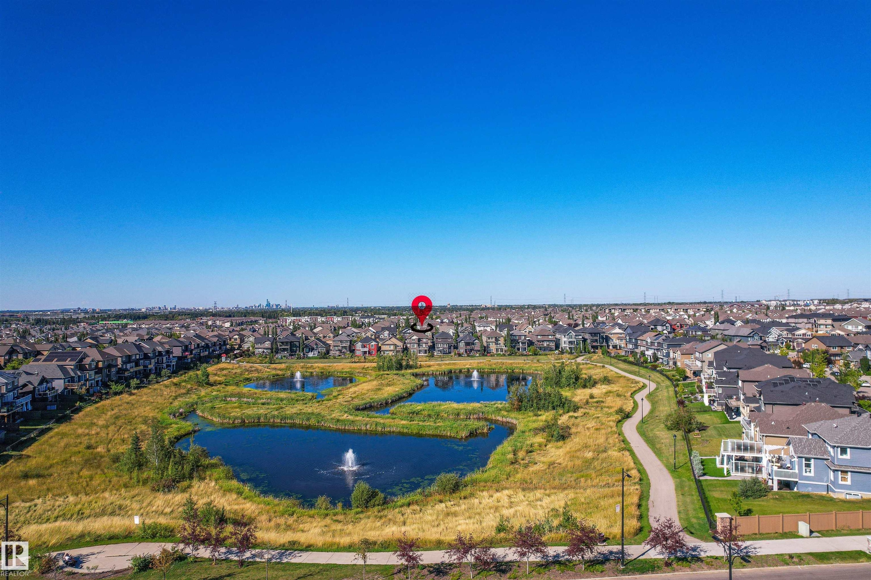 View of property location with nearby suburban area and a nearby body of water - 3198 Winspear Crescent Sw, Edmonton, AB - Outdoor With View