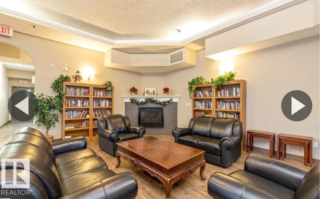 112 237 Youville Drive E, Edmonton, AB - Indoor Photo Showing Living Room With Fireplace