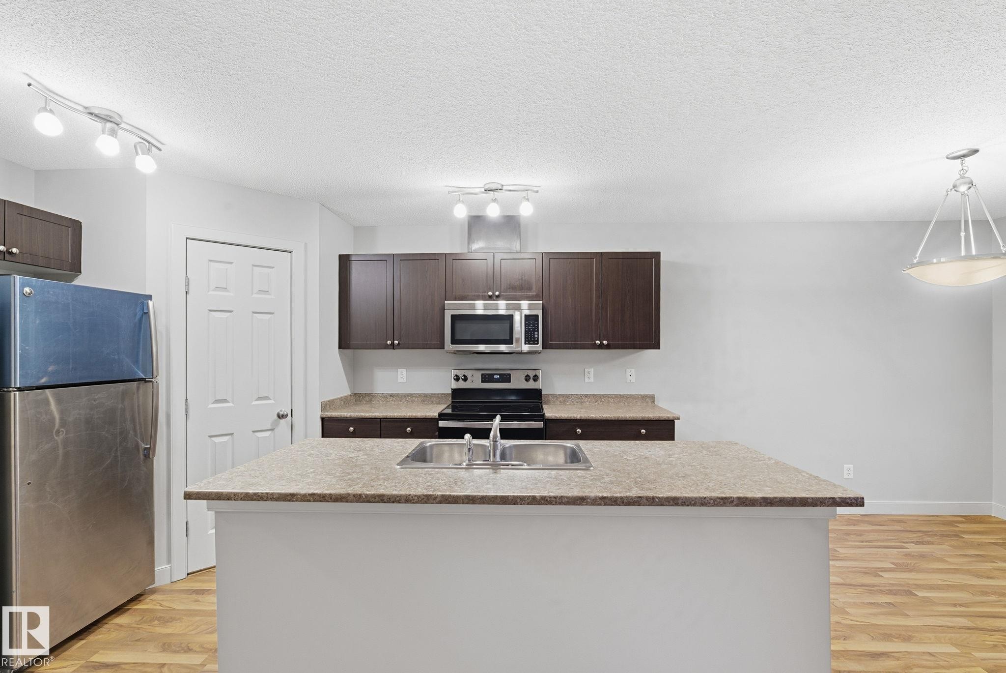 17365 8A Avenue, Edmonton, AB - Indoor Photo Showing Kitchen With Double Sink With Upgraded Kitchen