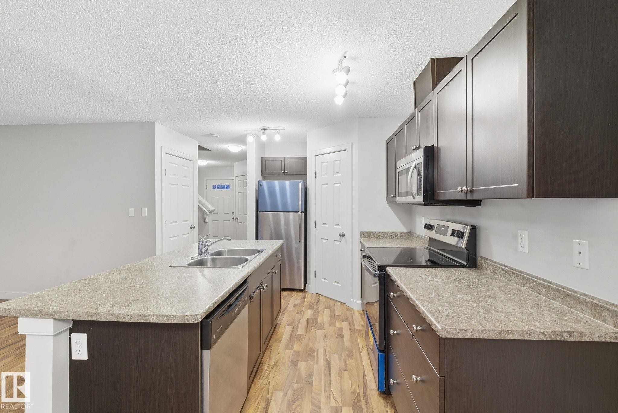 17365 8A Avenue, Edmonton, AB - Indoor Photo Showing Kitchen With Double Sink With Upgraded Kitchen