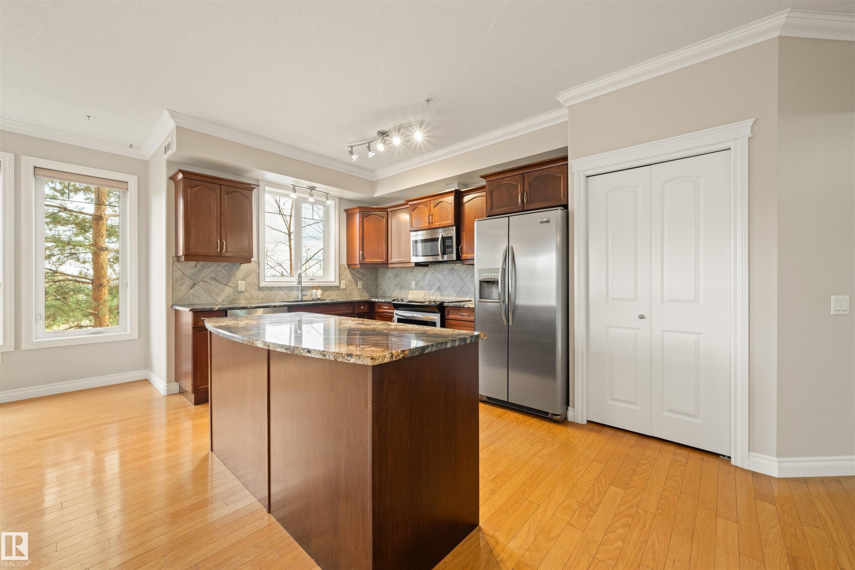 218 12408 15 Avenue, Edmonton, AB - Indoor Photo Showing Kitchen With Stainless Steel Kitchen