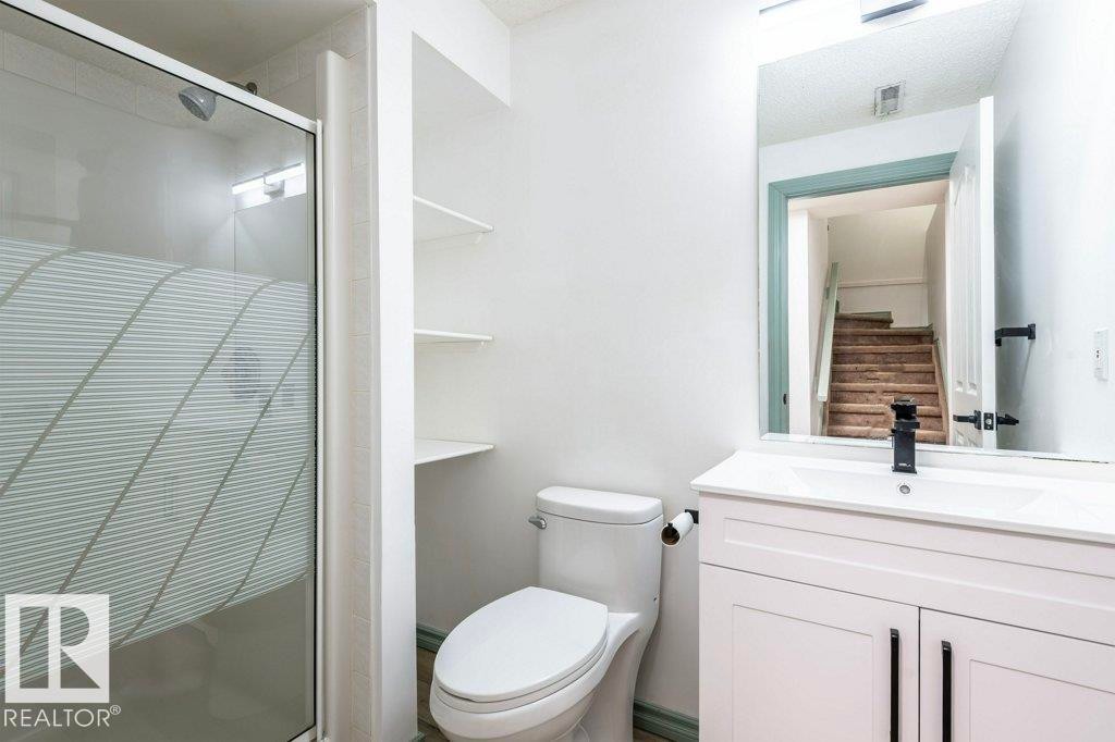 Full bath with a stall shower and vanity - 1112 118A Street Nw, Edmonton, AB - Indoor Photo Showing Bathroom