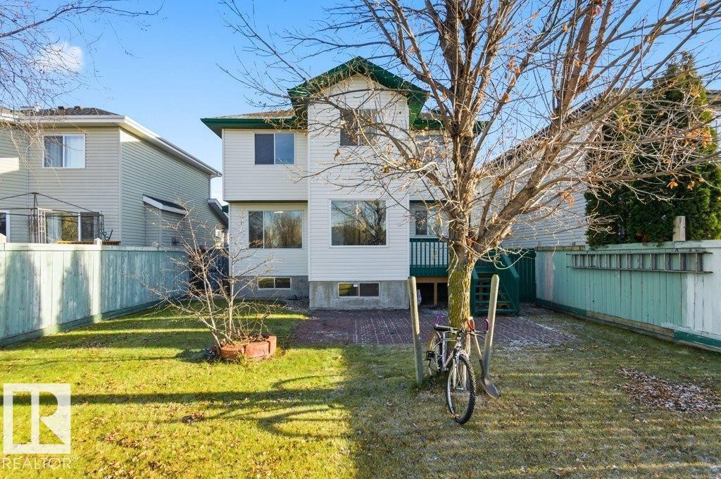 Back of house featuring a fenced backyard and a balcony - 1112 118A Street Nw, Edmonton, AB - Outdoor