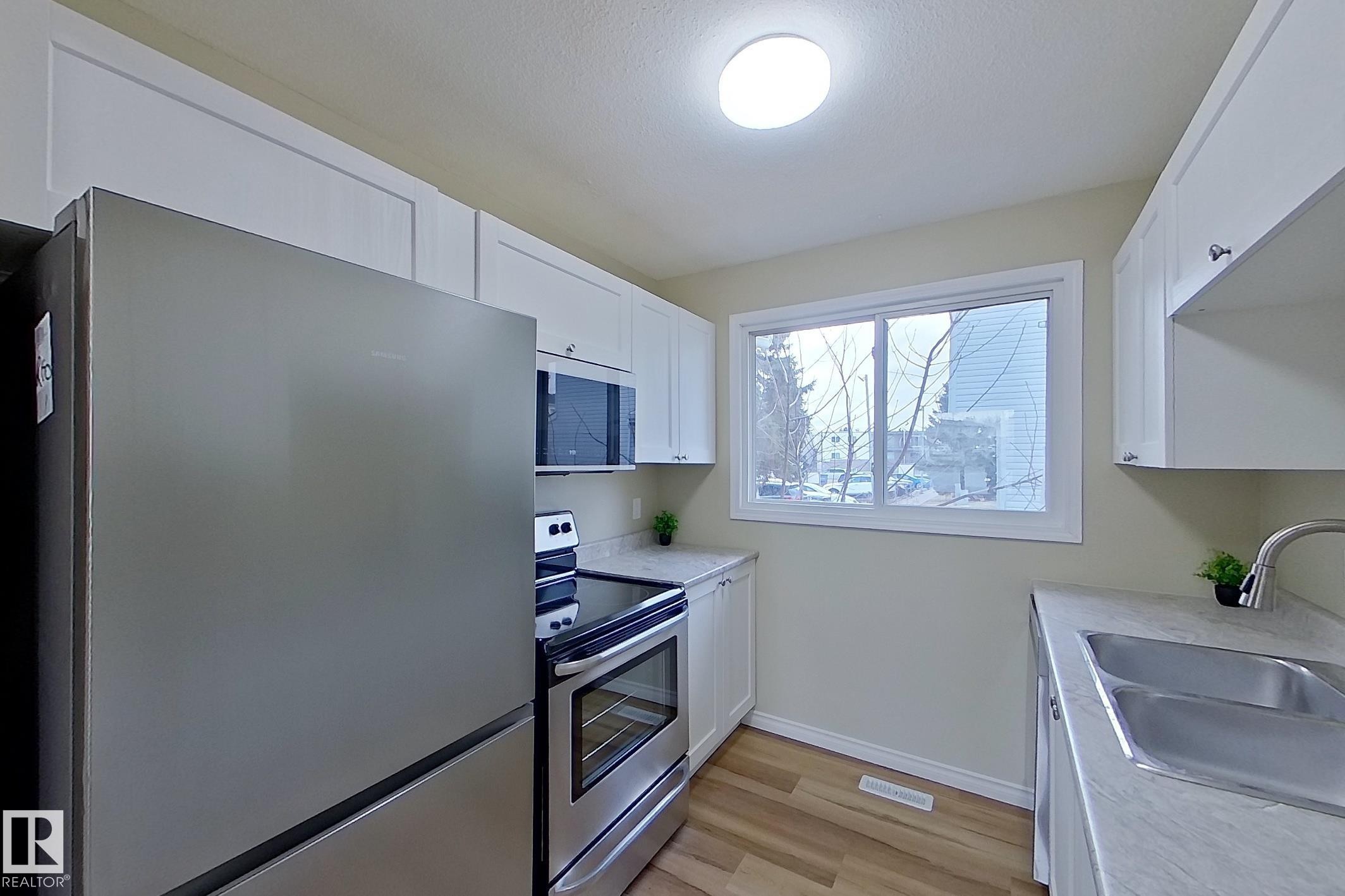112 Dickinsfield Court Nw, Edmonton, AB - Indoor Photo Showing Kitchen With Double Sink