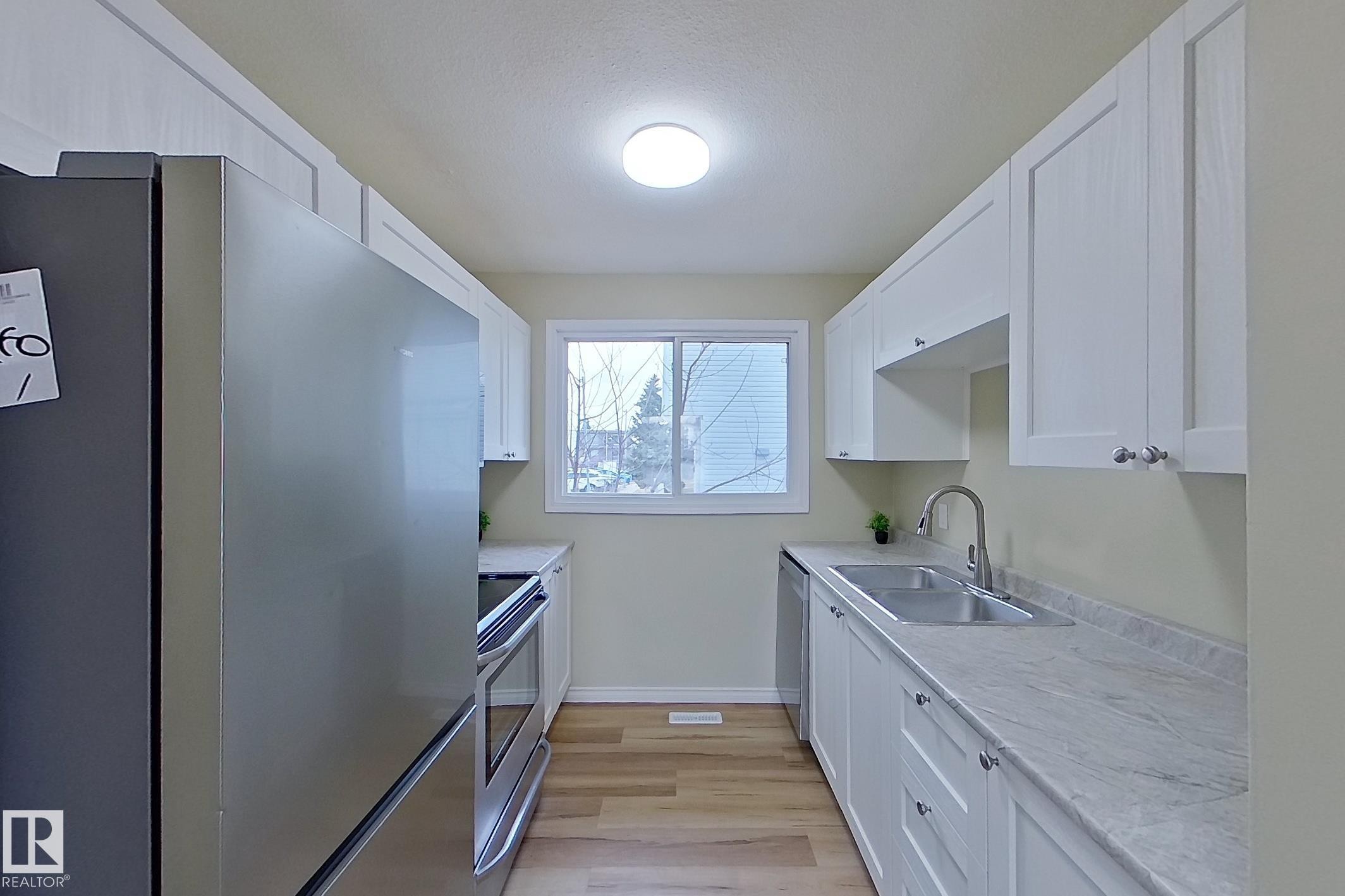 112 Dickinsfield Court Nw, Edmonton, AB - Indoor Photo Showing Kitchen With Double Sink