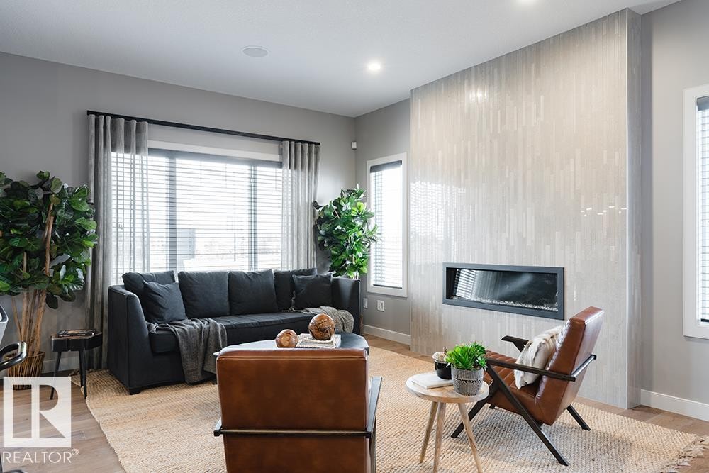 9389 Cooper Bend Bend, Edmonton, AB - Indoor Photo Showing Living Room With Fireplace