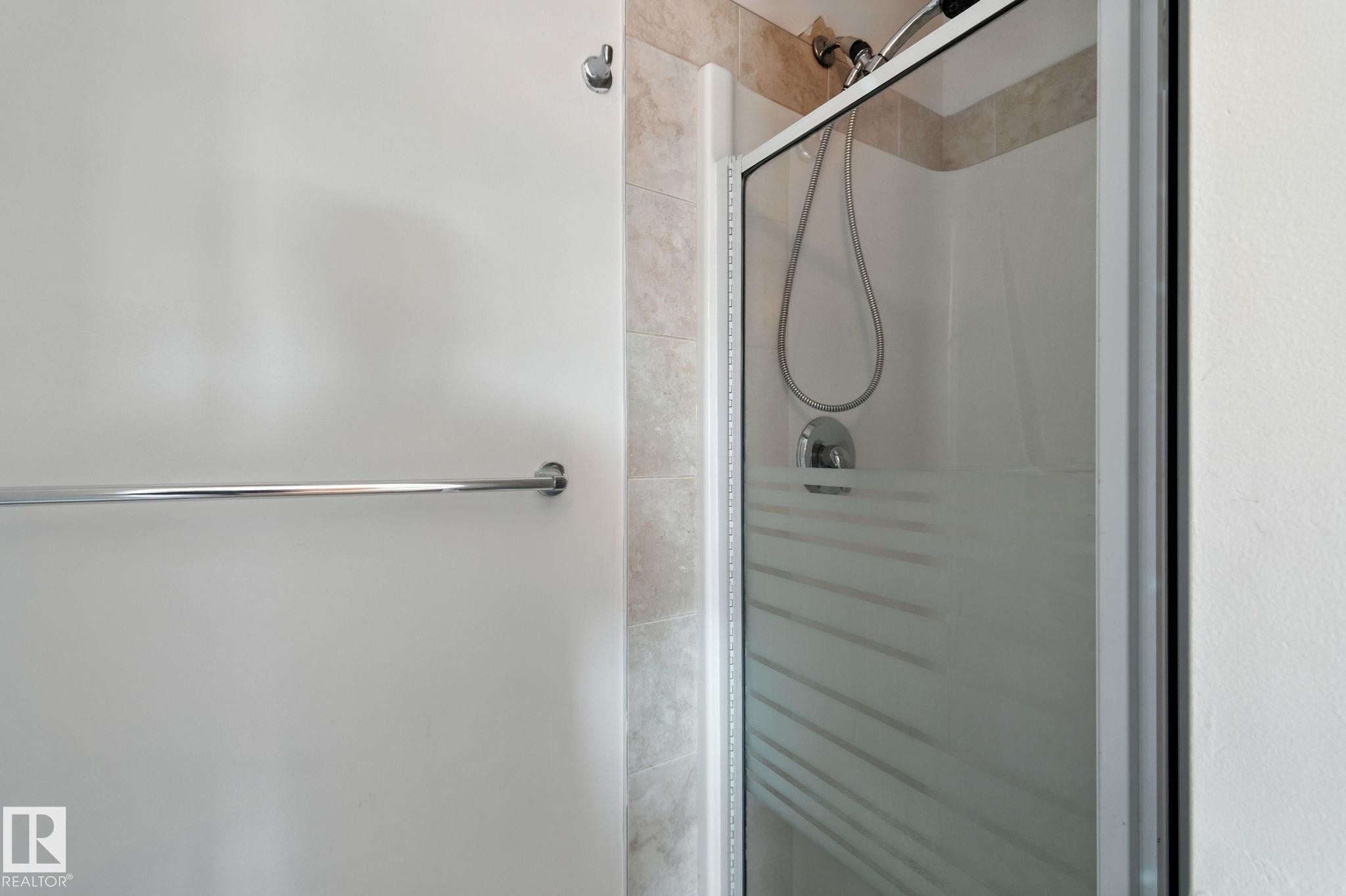 Full bathroom with a shower stall - 7836 7 Avenue, Edmonton, AB - Indoor Photo Showing Bathroom