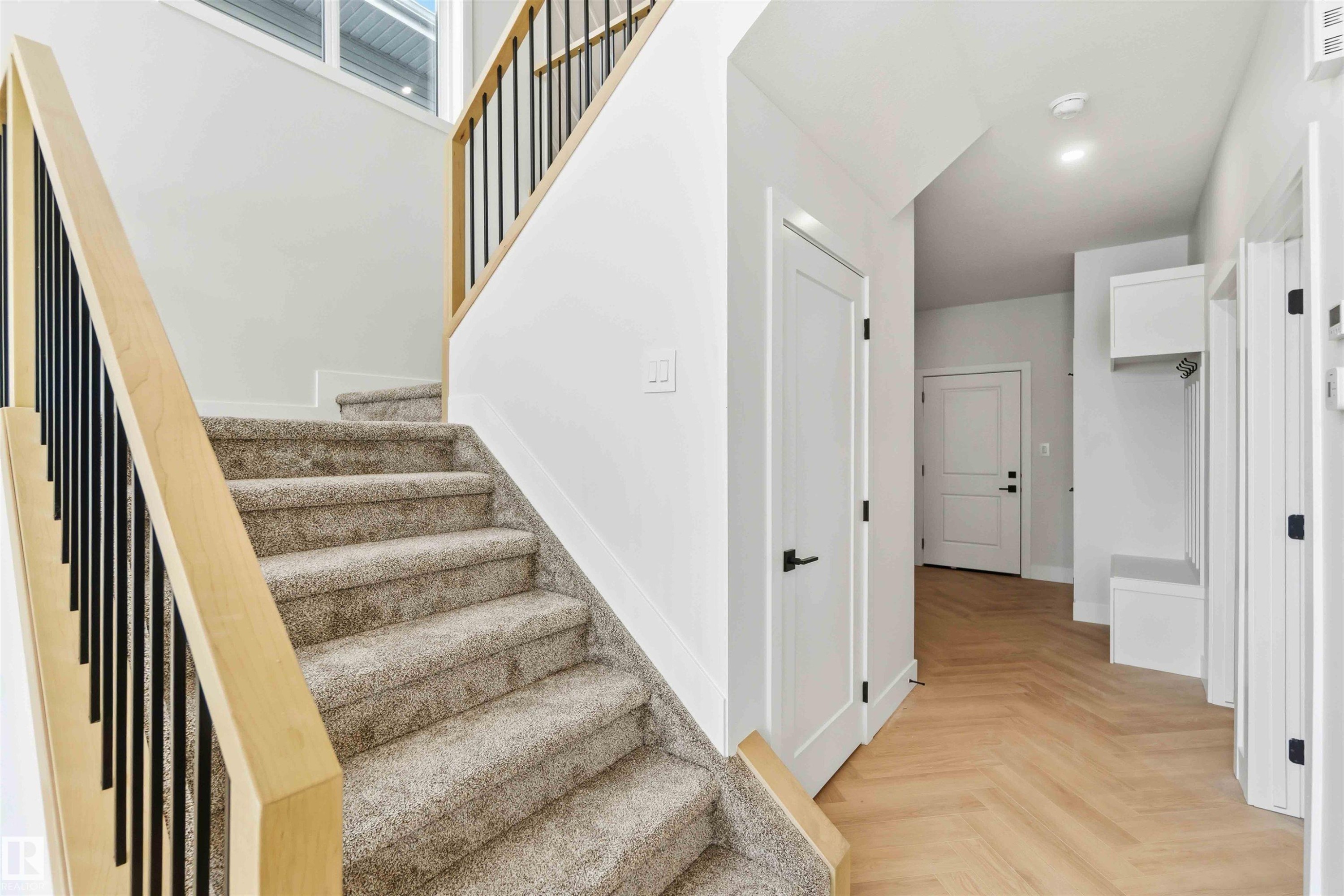 Staircase featuring parquet floors and recessed lighting - 94 Eldridge Pointe, St. Albert, AB - Indoor Photo Showing Other Room