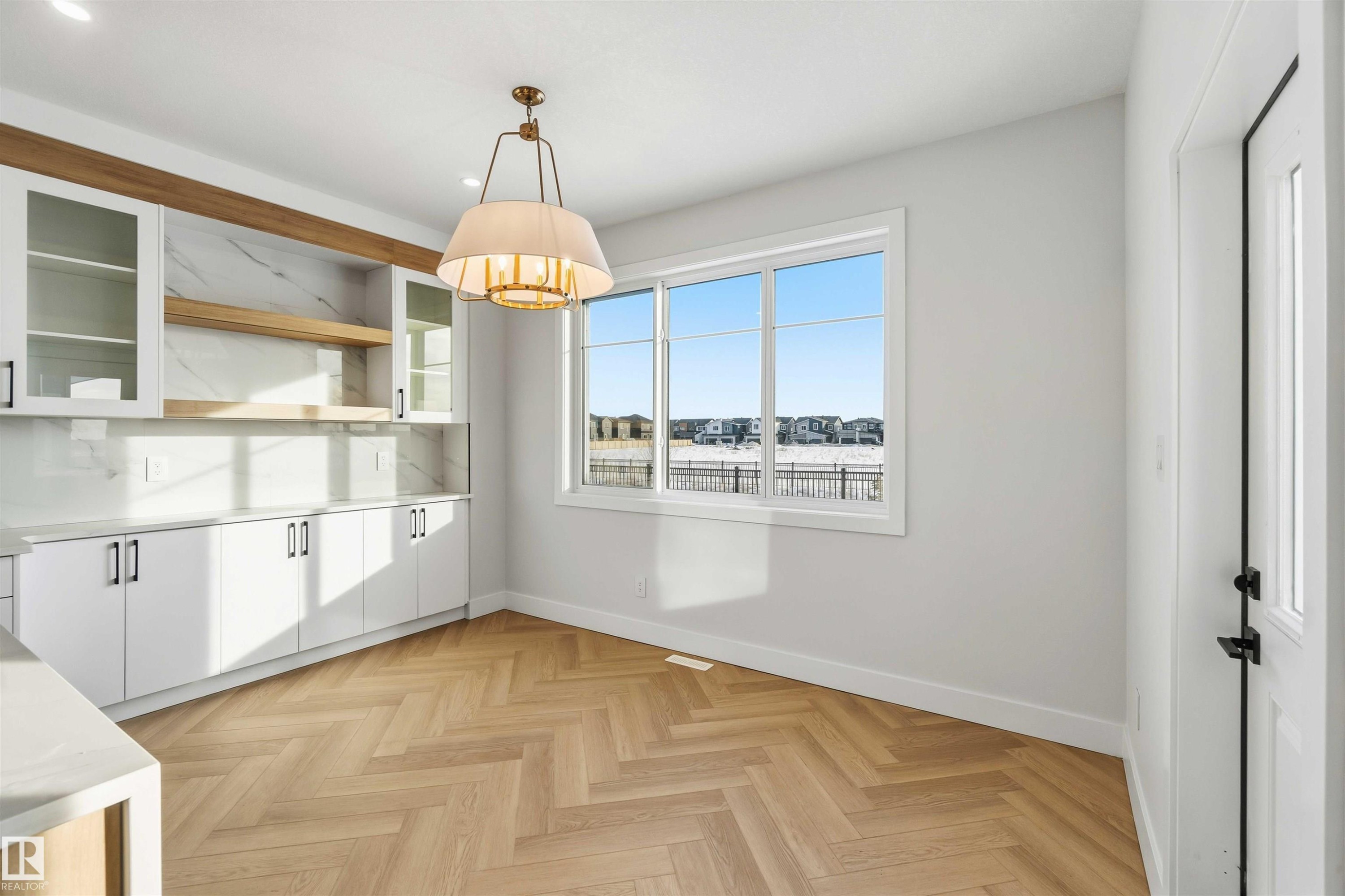 Unfurnished dining area featuring parquet floors and recessed lighting - 94 Eldridge Pointe, St. Albert, AB - Indoor