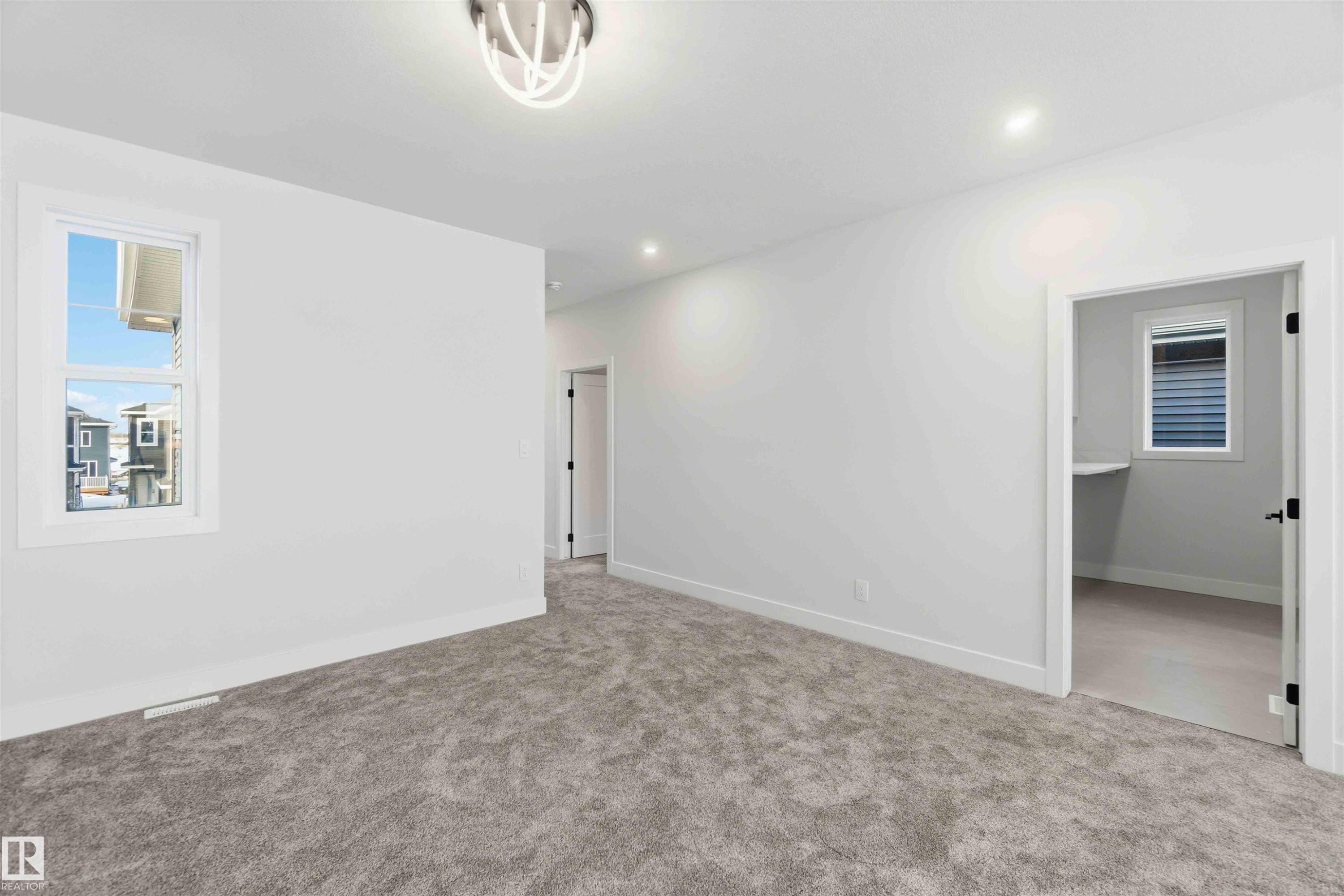 Carpeted spare room with baseboards and recessed lighting - 94 Eldridge Pointe, St. Albert, AB - Indoor Photo Showing Other Room