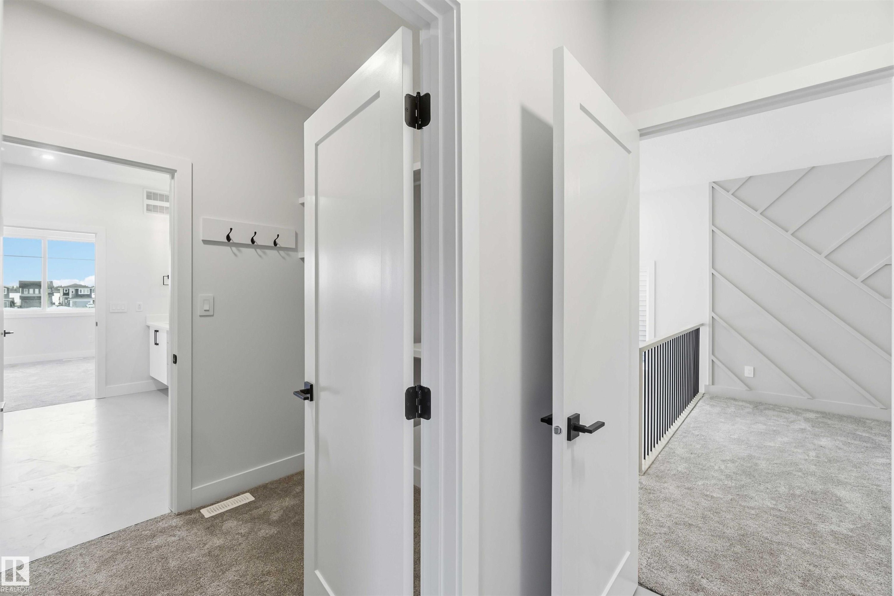 Corridor with light colored carpet - 94 Eldridge Pointe, St. Albert, AB - Indoor Photo Showing Other Room