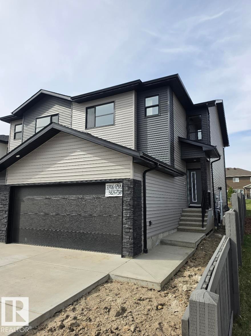 Contemporary multi-level residence featuring contrasting siding and stone veneer accents - 7706 174A Avenue, Edmonton, AB - Outdoor