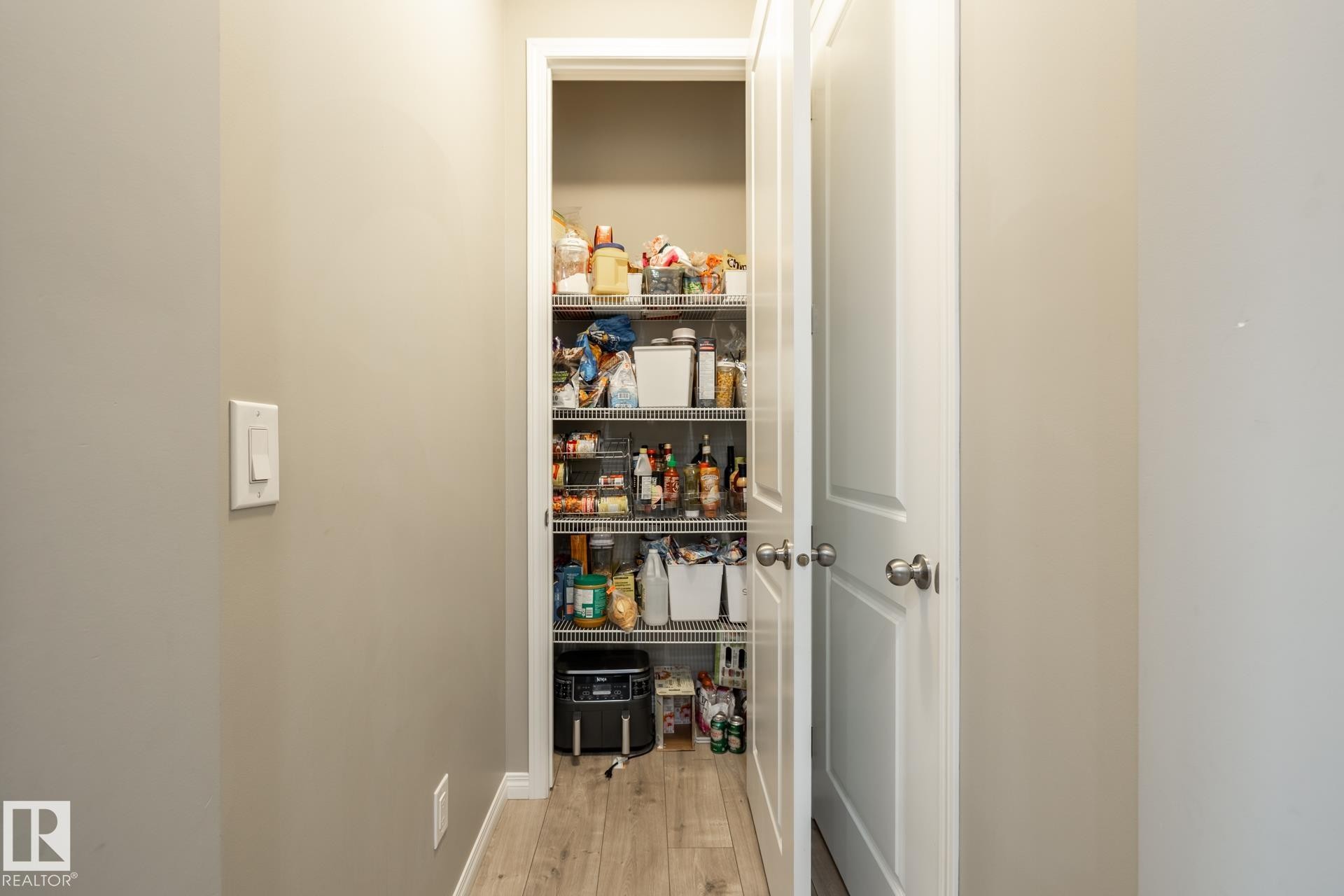 View of pantry - 5 2072 Wonnacott Way, Edmonton, AB - Indoor Photo Showing Other Room