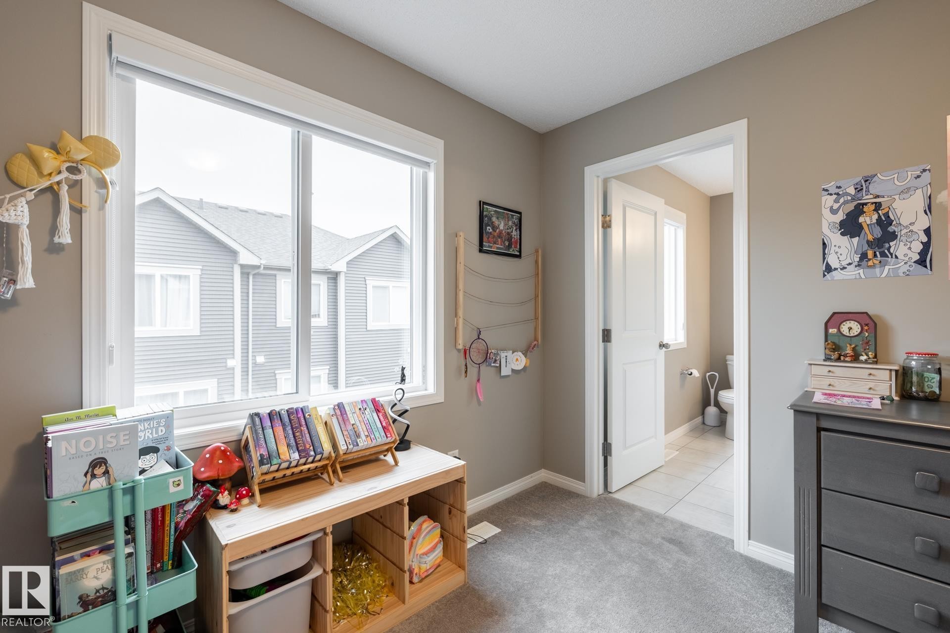 Game room featuring light carpet and baseboards - 5 2072 Wonnacott Way, Edmonton, AB - Indoor