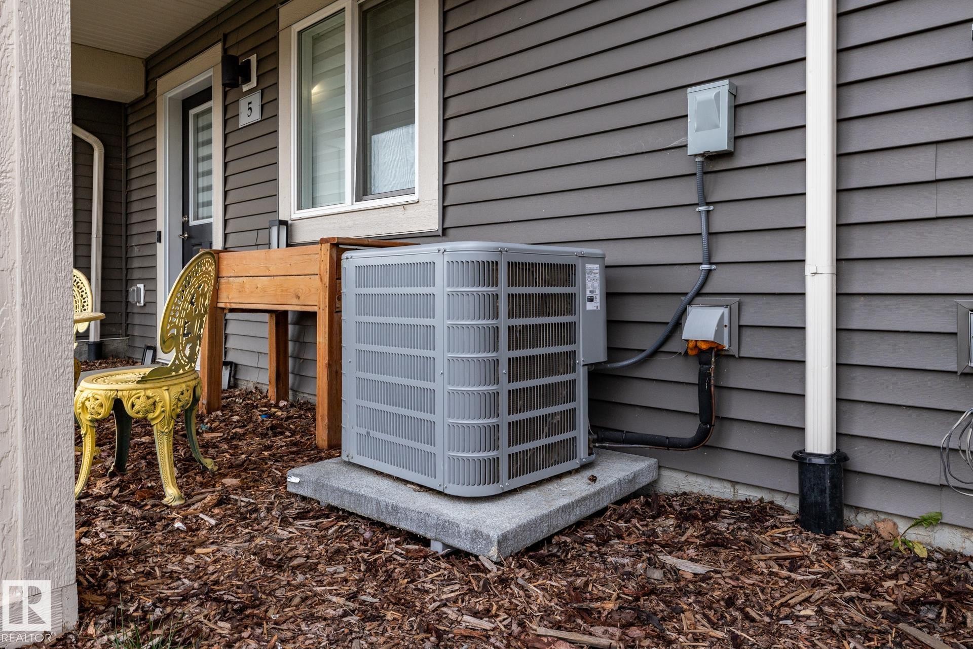 Exterior view of a central AC unit - 5 2072 Wonnacott Way, Edmonton, AB - Outdoor