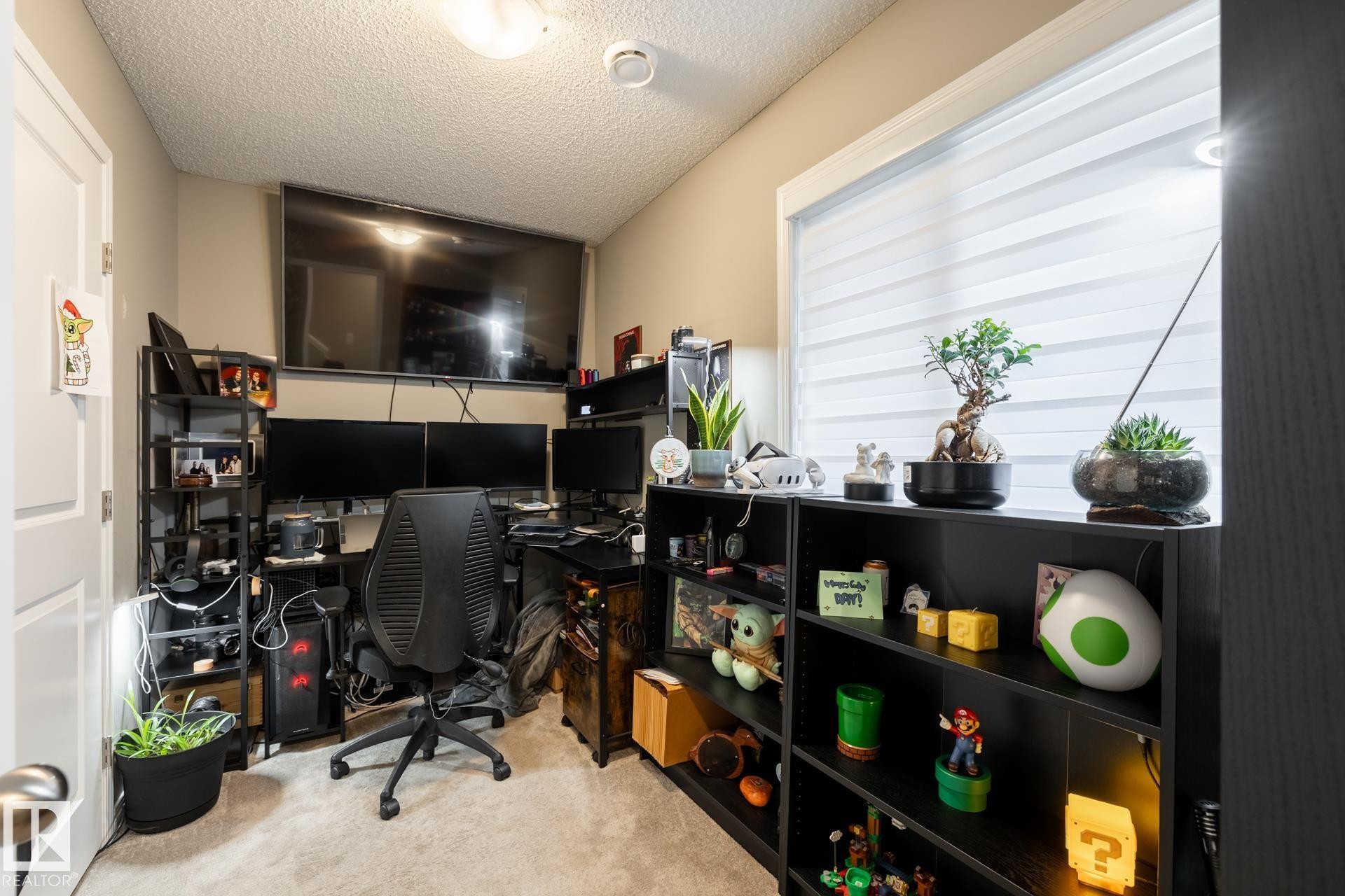 Office area with a textured ceiling and light carpet - 5 2072 Wonnacott Way, Edmonton, AB - Indoor Photo Showing Office
