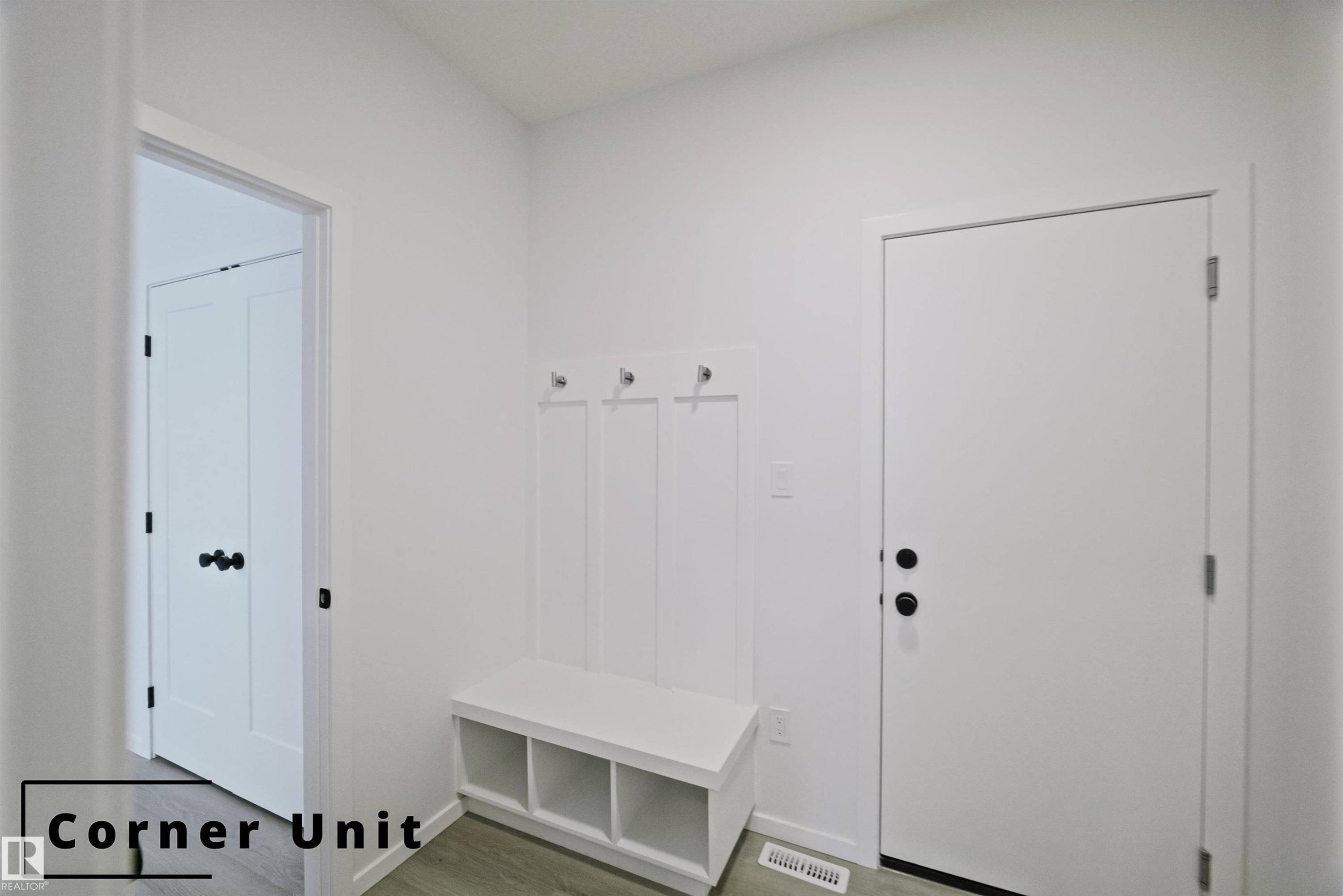 Mudroom featuring wood finished floors and baseboards - 7585 174A Avenue, Edmonton, AB - Indoor Photo Showing Other Room