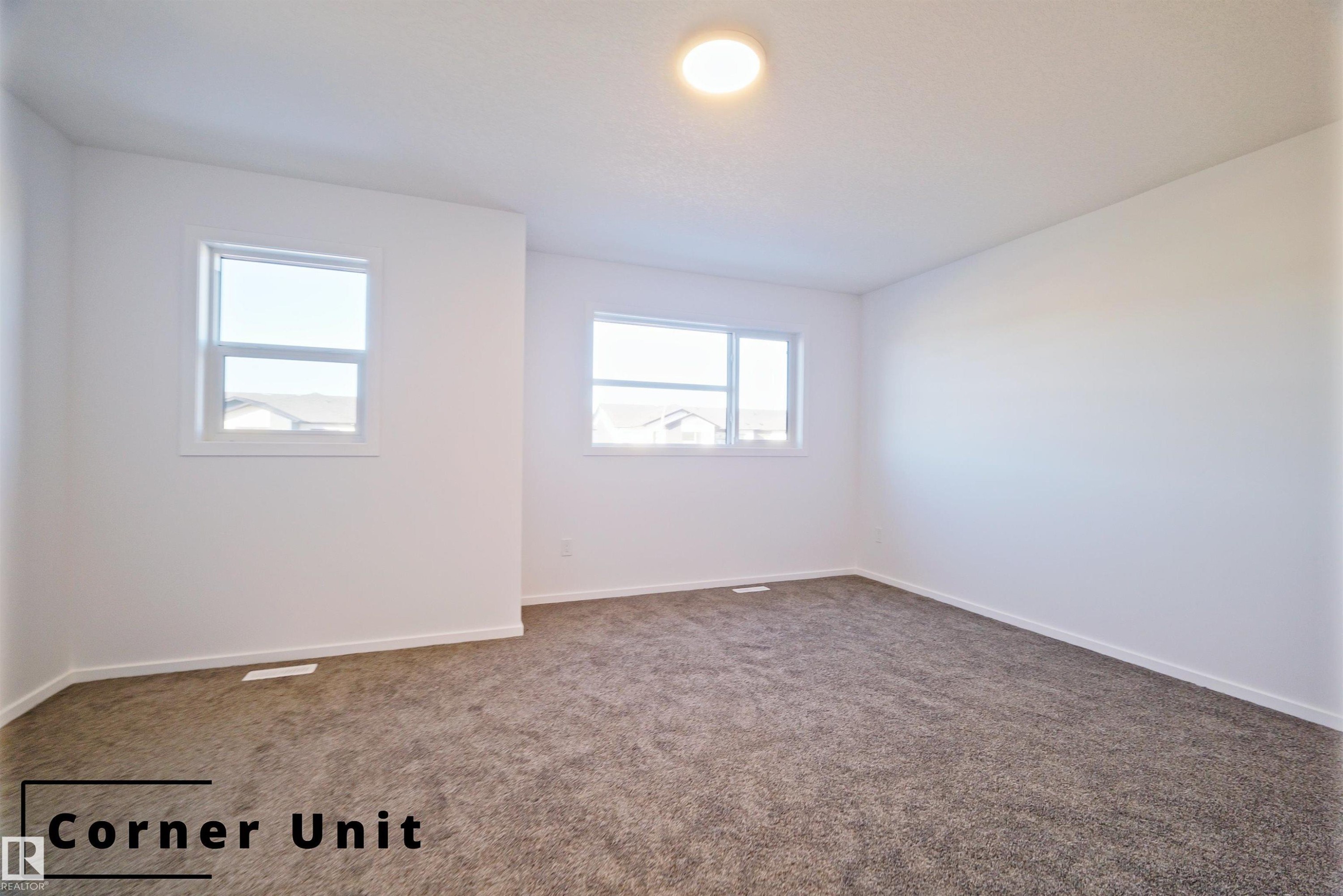 Empty room with baseboards and carpet - 7585 174A Avenue, Edmonton, AB - Indoor Photo Showing Other Room