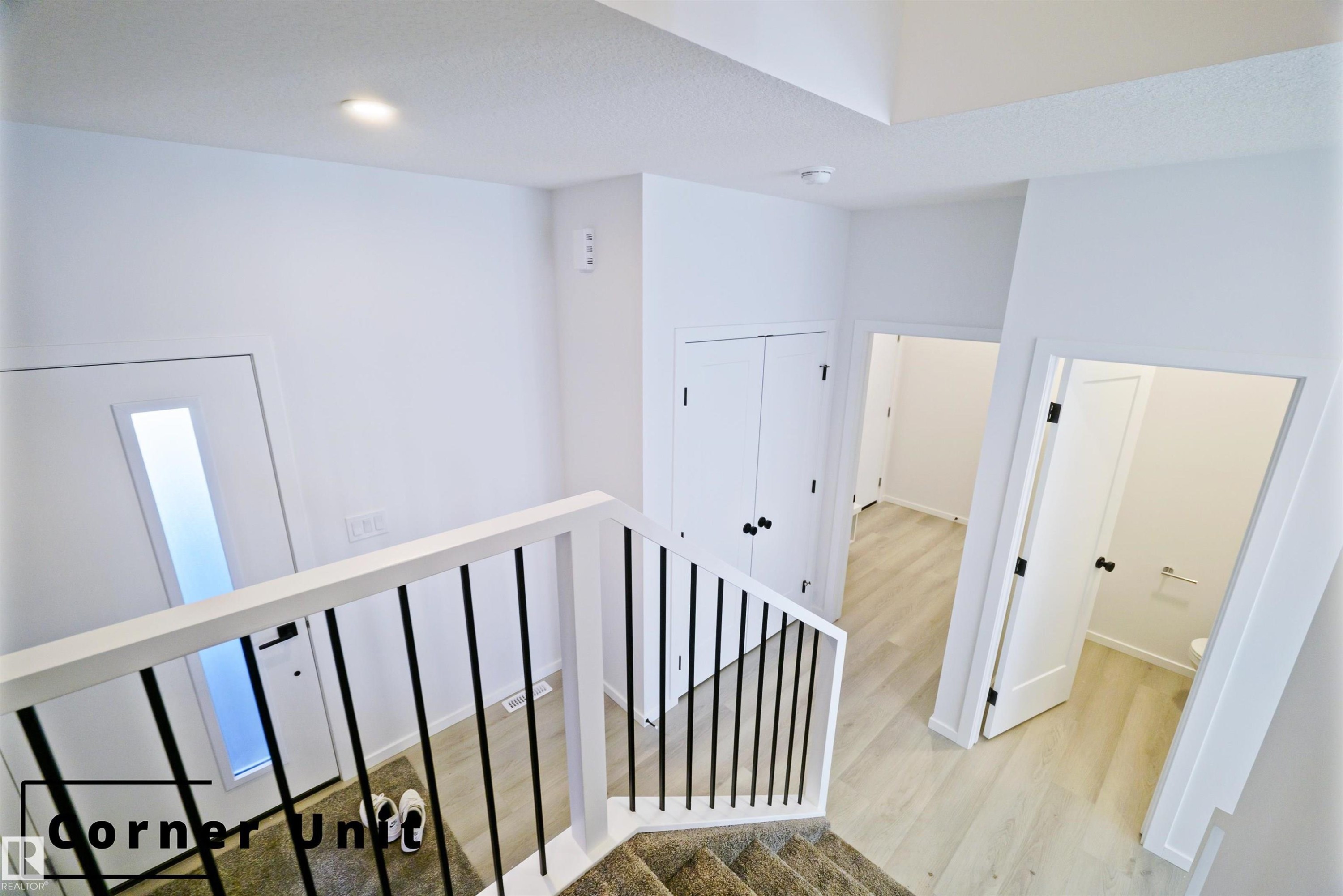 Corridor with light wood-style floors and a textured ceiling - 7585 174A Avenue, Edmonton, AB - Indoor Photo Showing Other Room