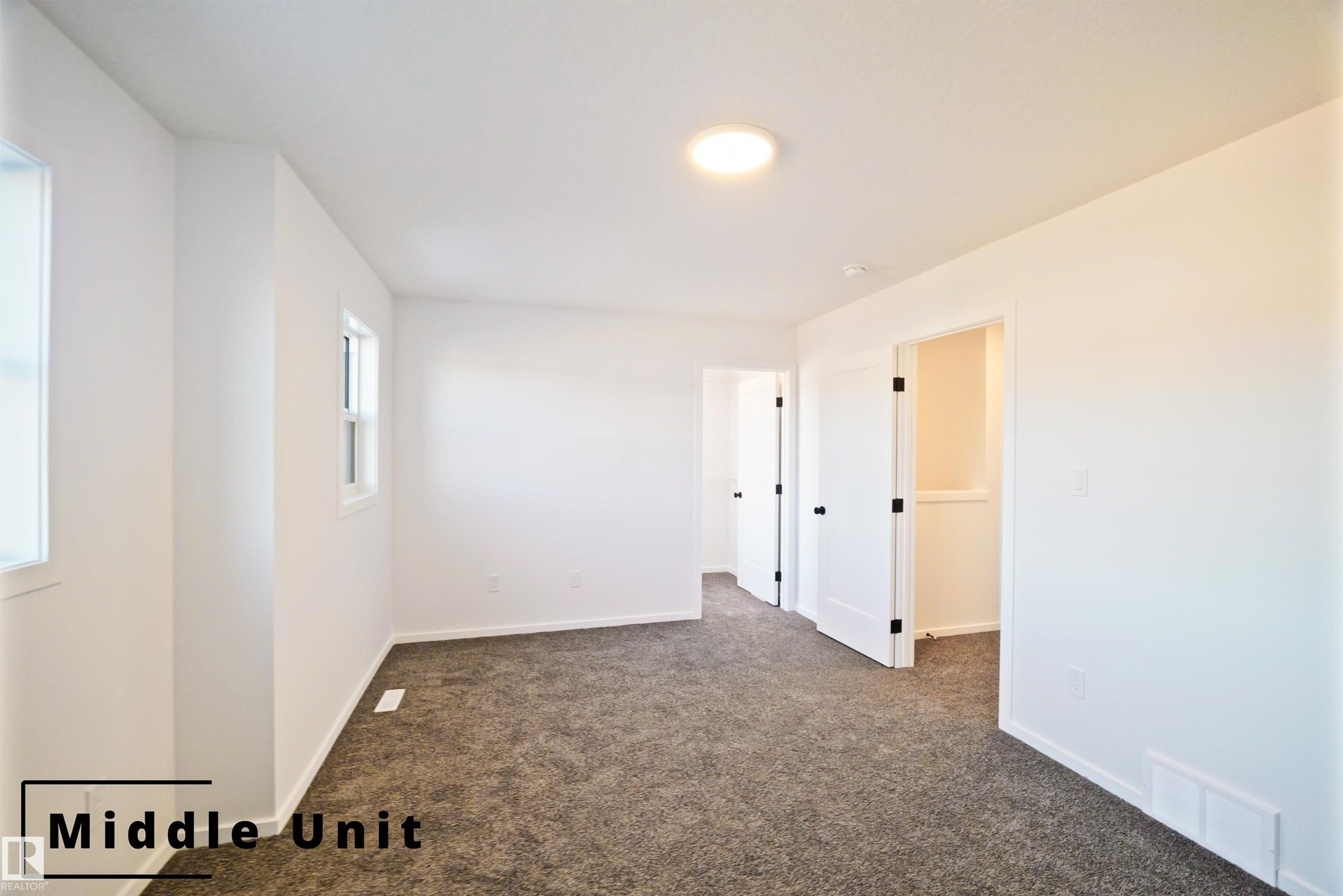 Spare room with carpet and baseboards - 7585 174A Avenue, Edmonton, AB - Indoor Photo Showing Other Room