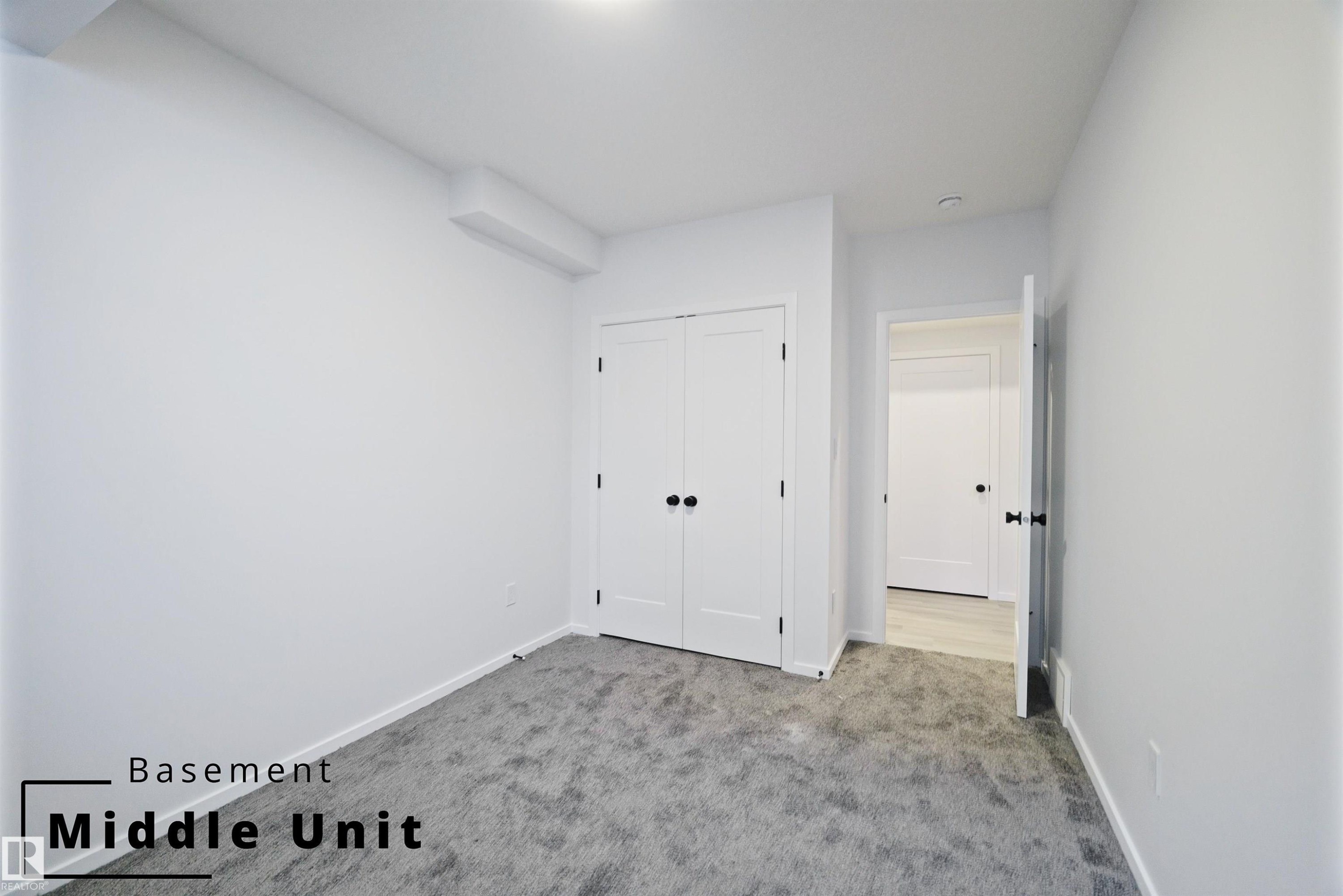 Unfurnished bedroom with carpet flooring and a closet - 7585 174A Avenue, Edmonton, AB - Indoor Photo Showing Other Room
