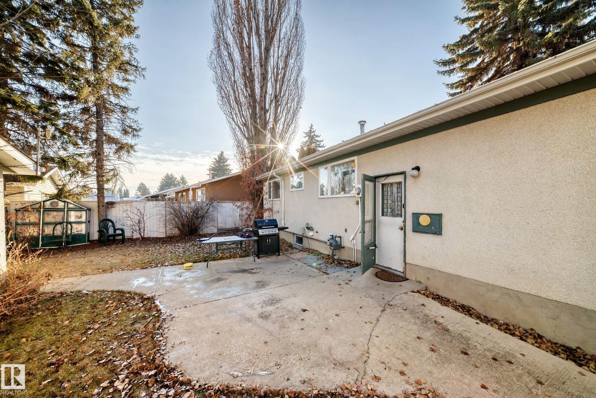 View of yard with a patio area and an outdoor structure - Edmonton, AB - Outdoor With Exterior