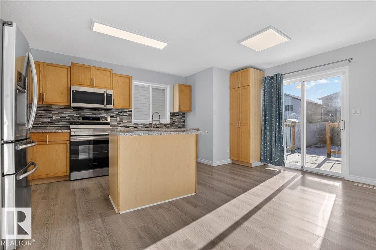 3323 26 Avenue, Edmonton, AB - Indoor Photo Showing Kitchen With Stainless Steel Kitchen