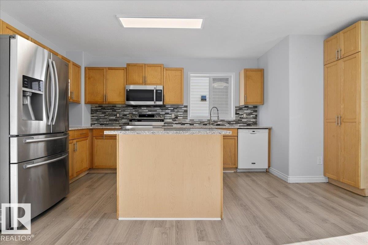 3323 26 Avenue, Edmonton, AB - Indoor Photo Showing Kitchen With Stainless Steel Kitchen With Double Sink
