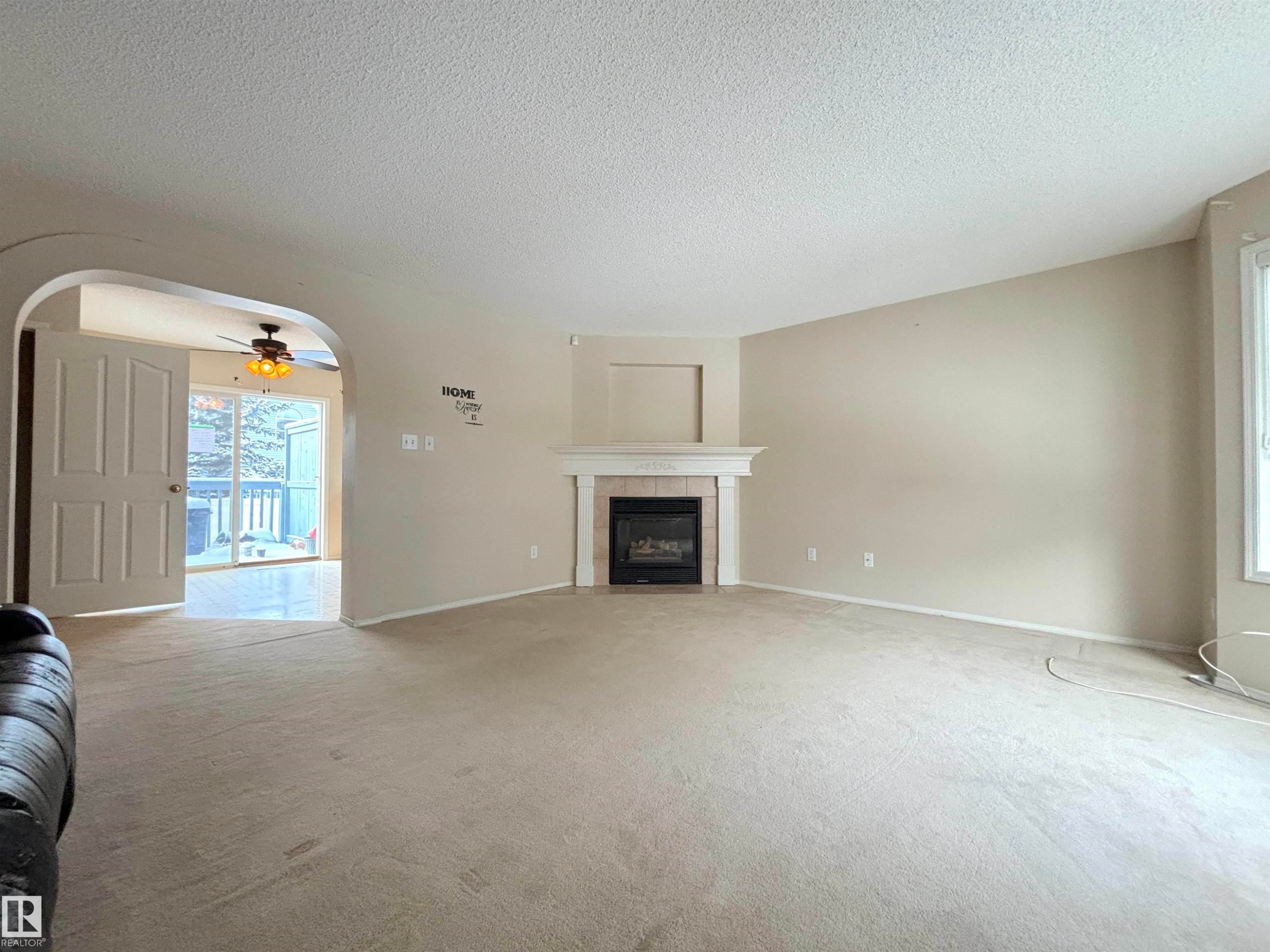 124 1670 Jamha Road, Edmonton, AB - Indoor Photo Showing Living Room With Fireplace