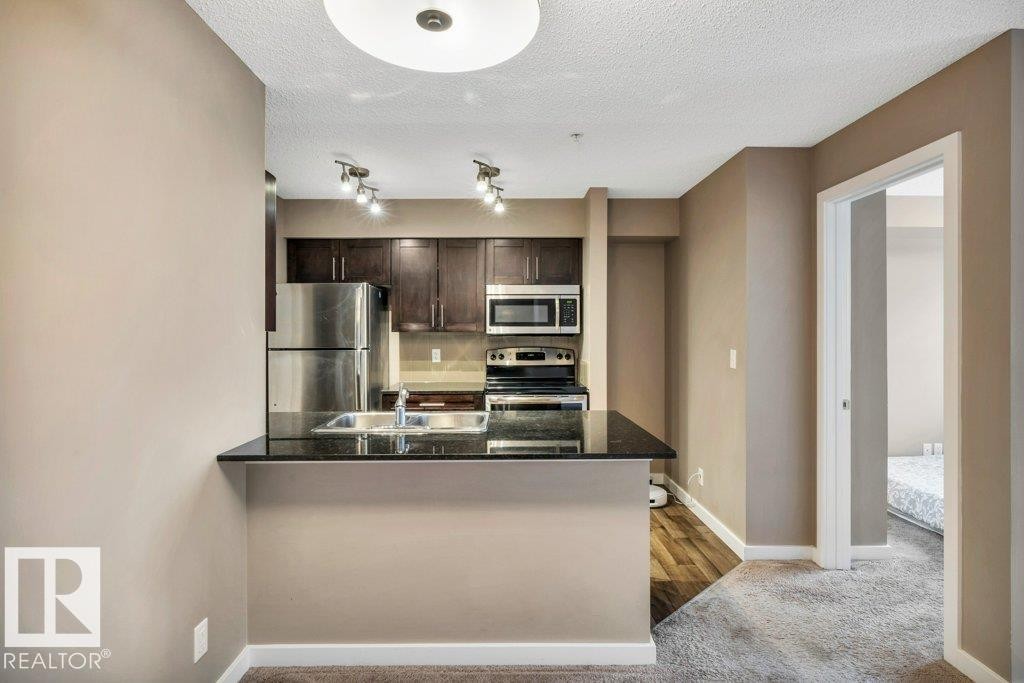 208 12035 22 Avenue, Edmonton, AB - Indoor Photo Showing Kitchen With Stainless Steel Kitchen With Double Sink