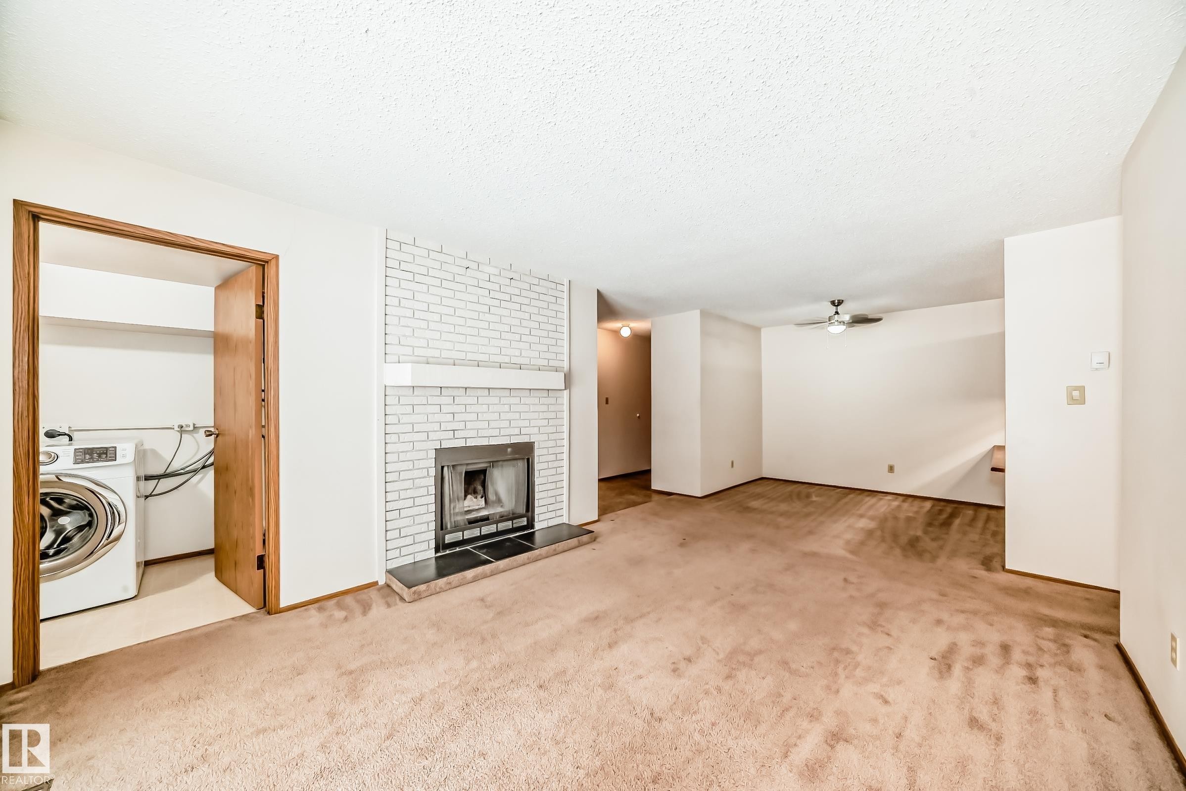 104 70 Alpine Place, St. Albert, AB - Indoor With Fireplace