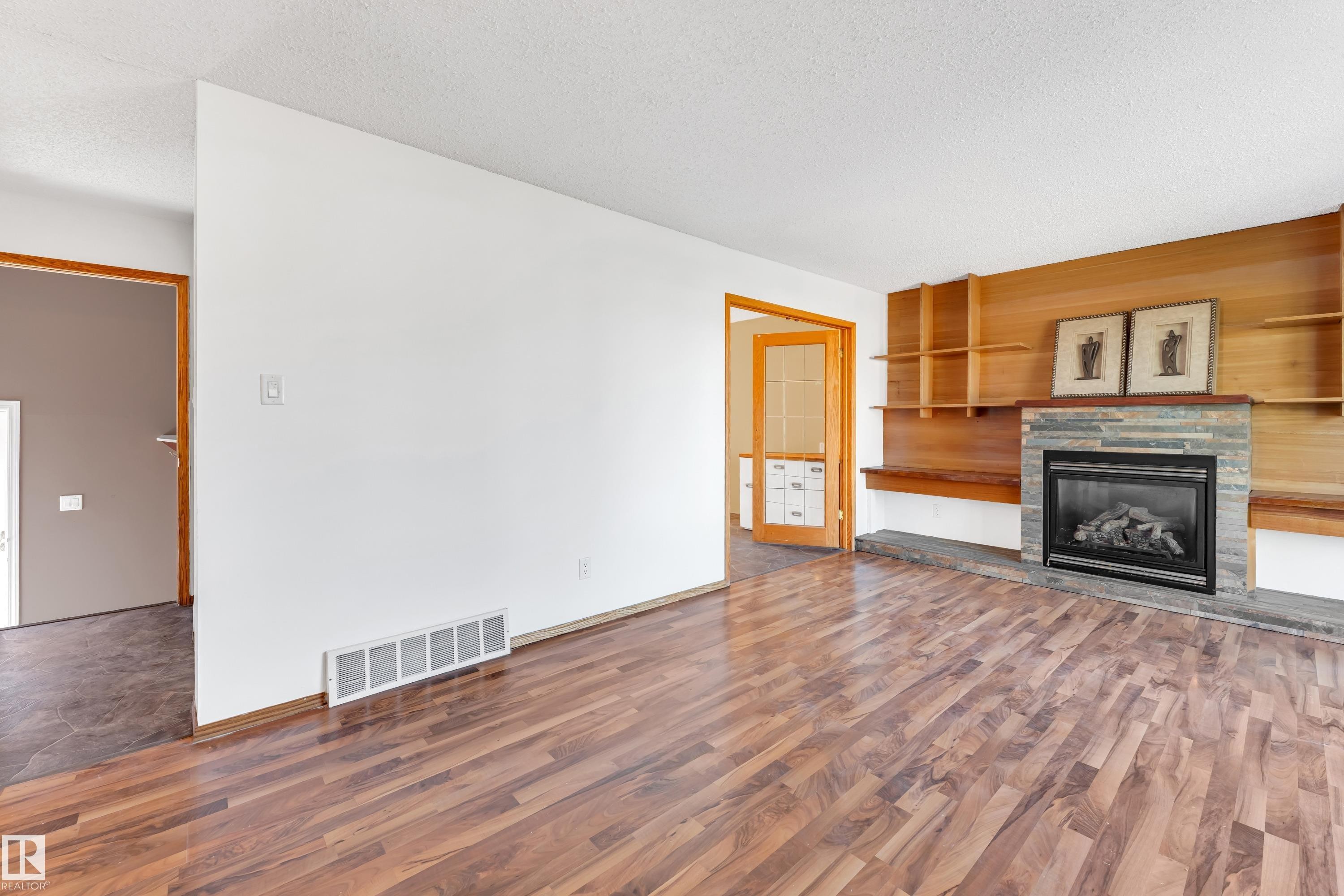 8103 14 Avenue, Edmonton, AB - Indoor Photo Showing Living Room With Fireplace