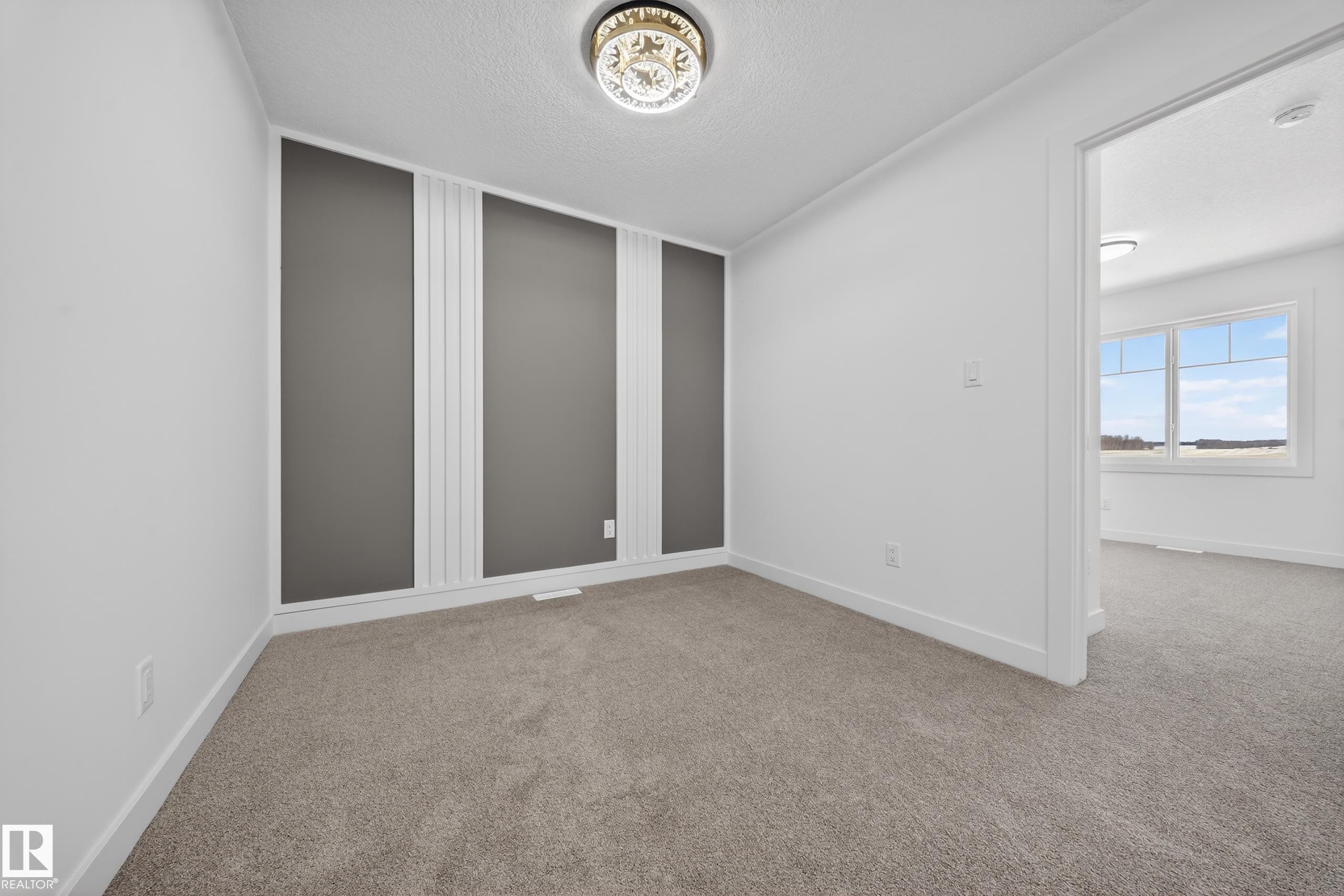 Unfurnished room with a textured ceiling and light colored carpet - 129 Pierwyck Loop, Spruce Grove, AB - Indoor Photo Showing Other Room