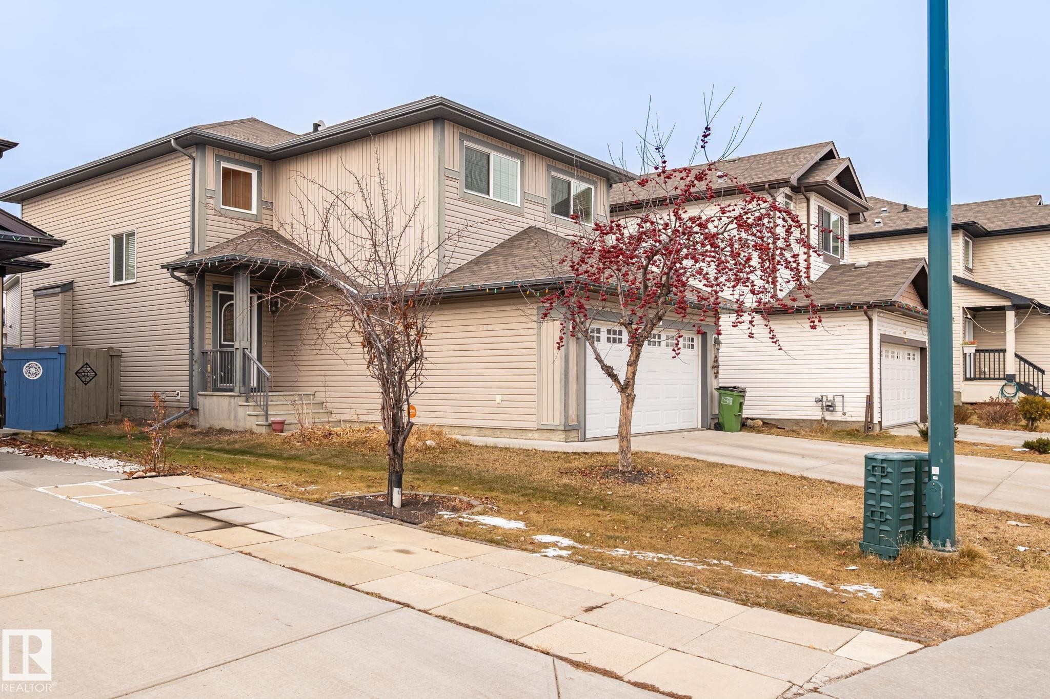Traditional home featuring driveway and a shingled roof - 1888 33 Street, Edmonton, AB - Outdoor