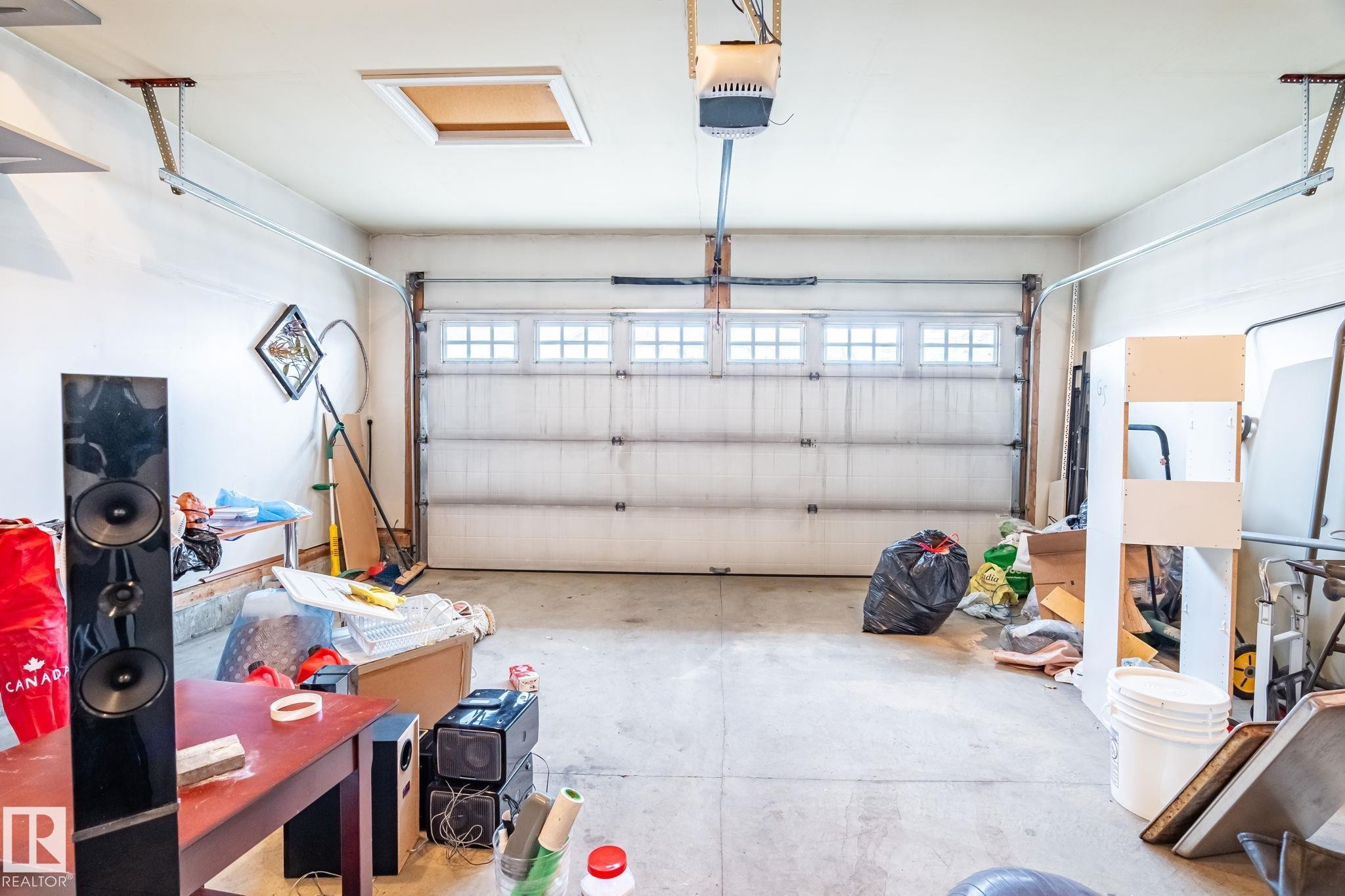 Garage featuring a garage door opener - 1888 33 Street, Edmonton, AB - Indoor Photo Showing Garage