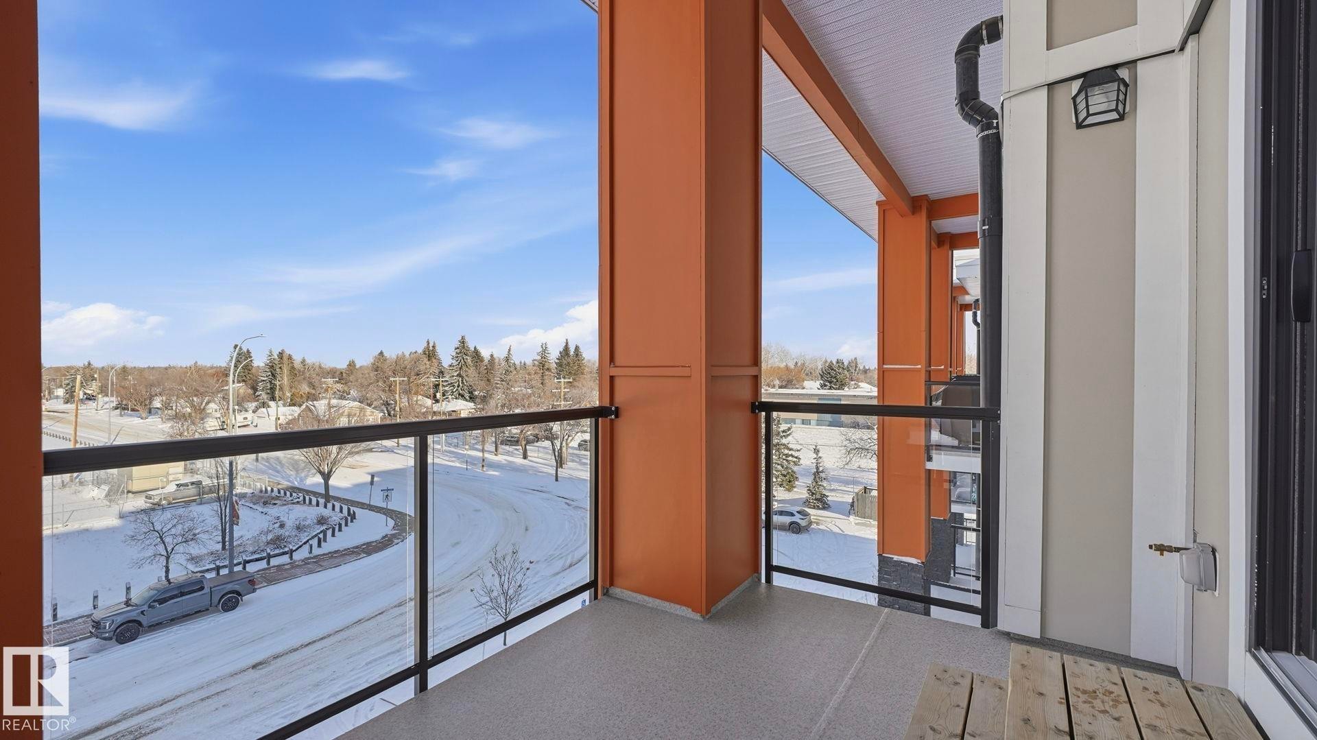 View of snow covered back of property - 401 17 Columbia Avenue W, Devon, AB - Outdoor With Balcony With Exterior