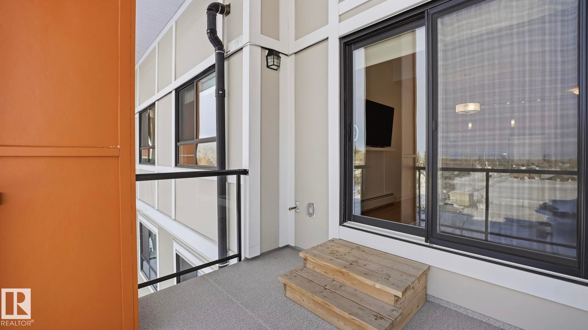 Property entrance with a baseboard heating unit - 401 17 Columbia Avenue W, Devon, AB - With Balcony With Exterior