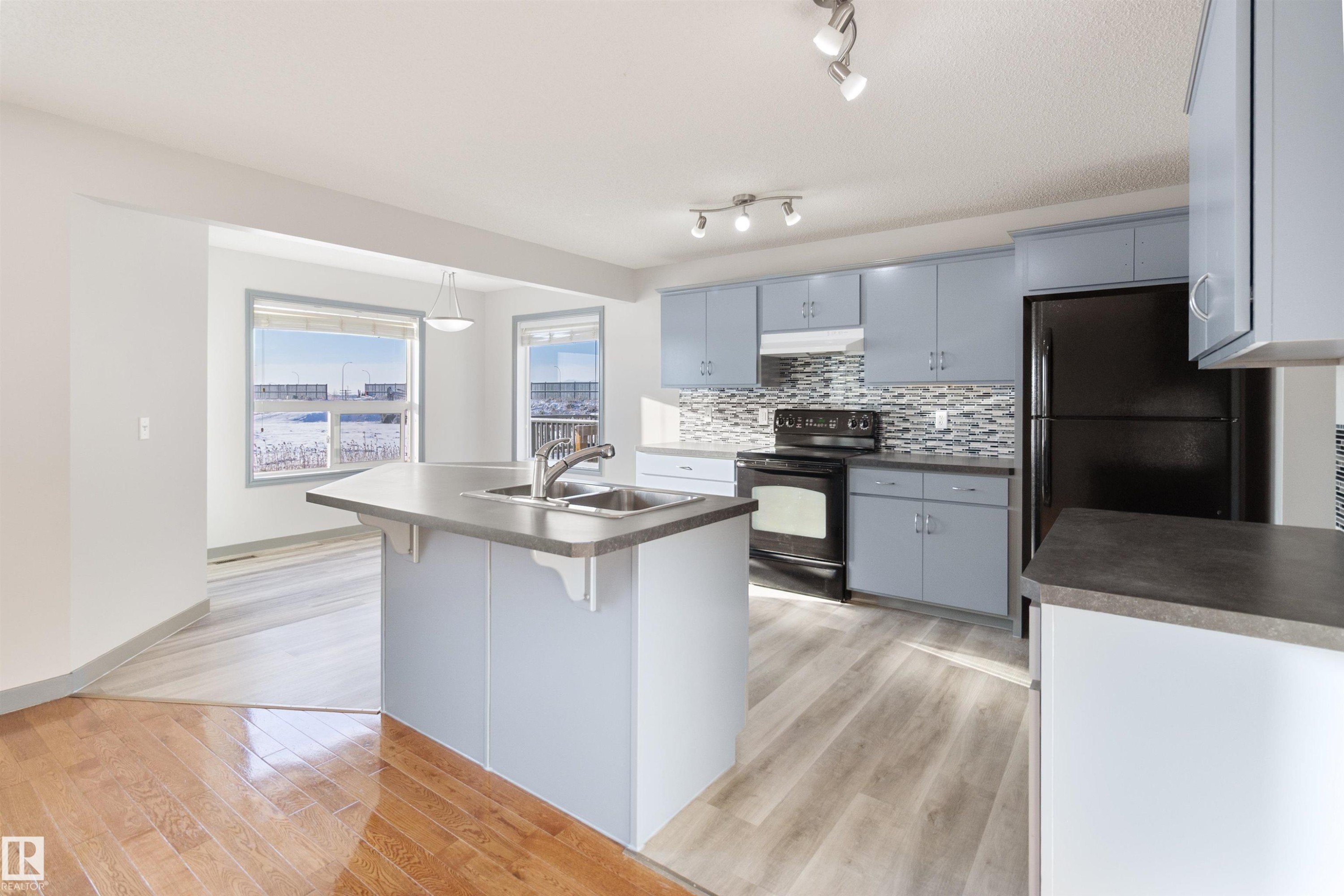 75 Dunlop Wynd, Leduc, AB - Indoor Photo Showing Kitchen With Double Sink